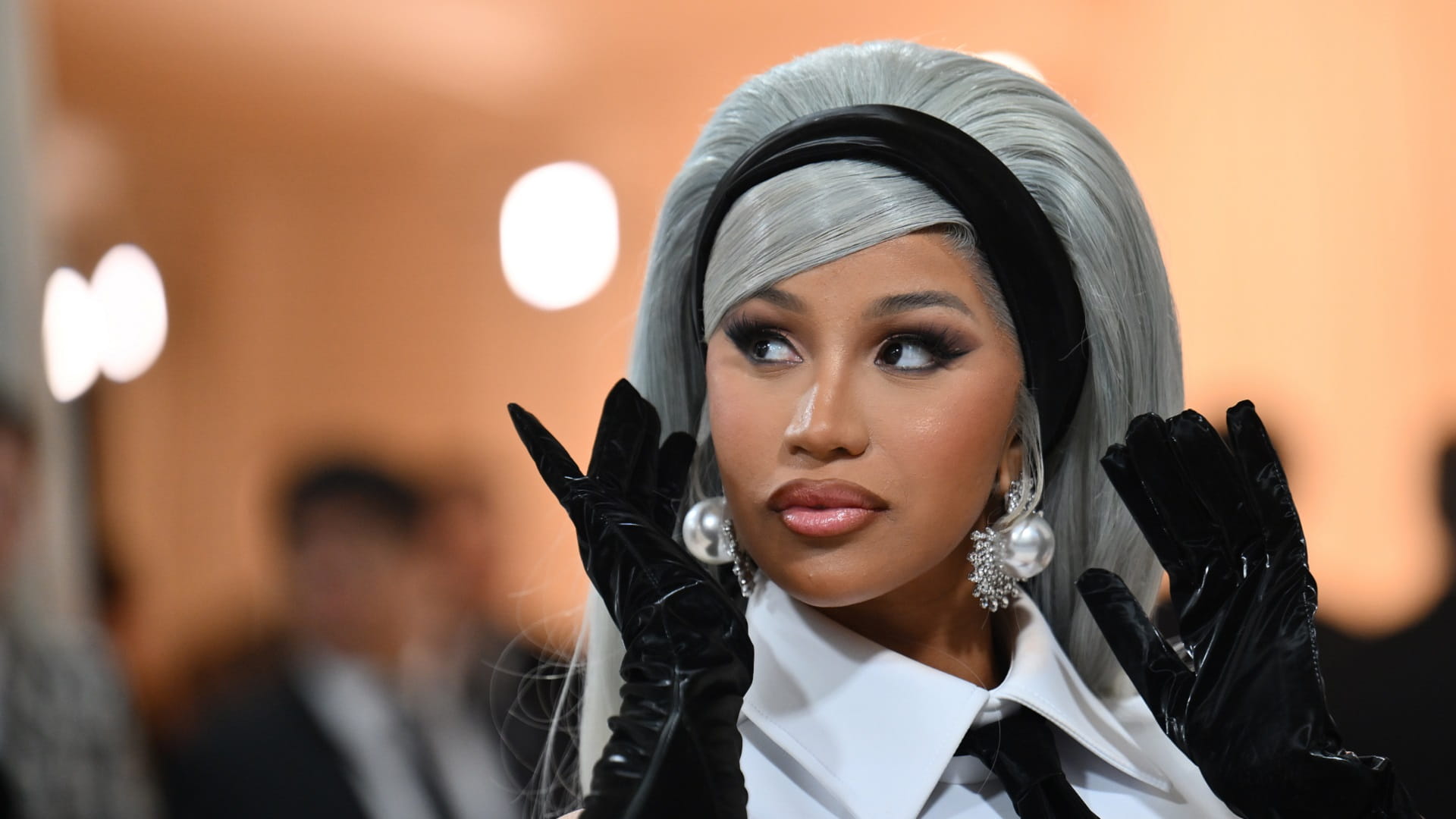 Image for the title: Rapper Cardi B, the target of a thrown liquid, retaliates 