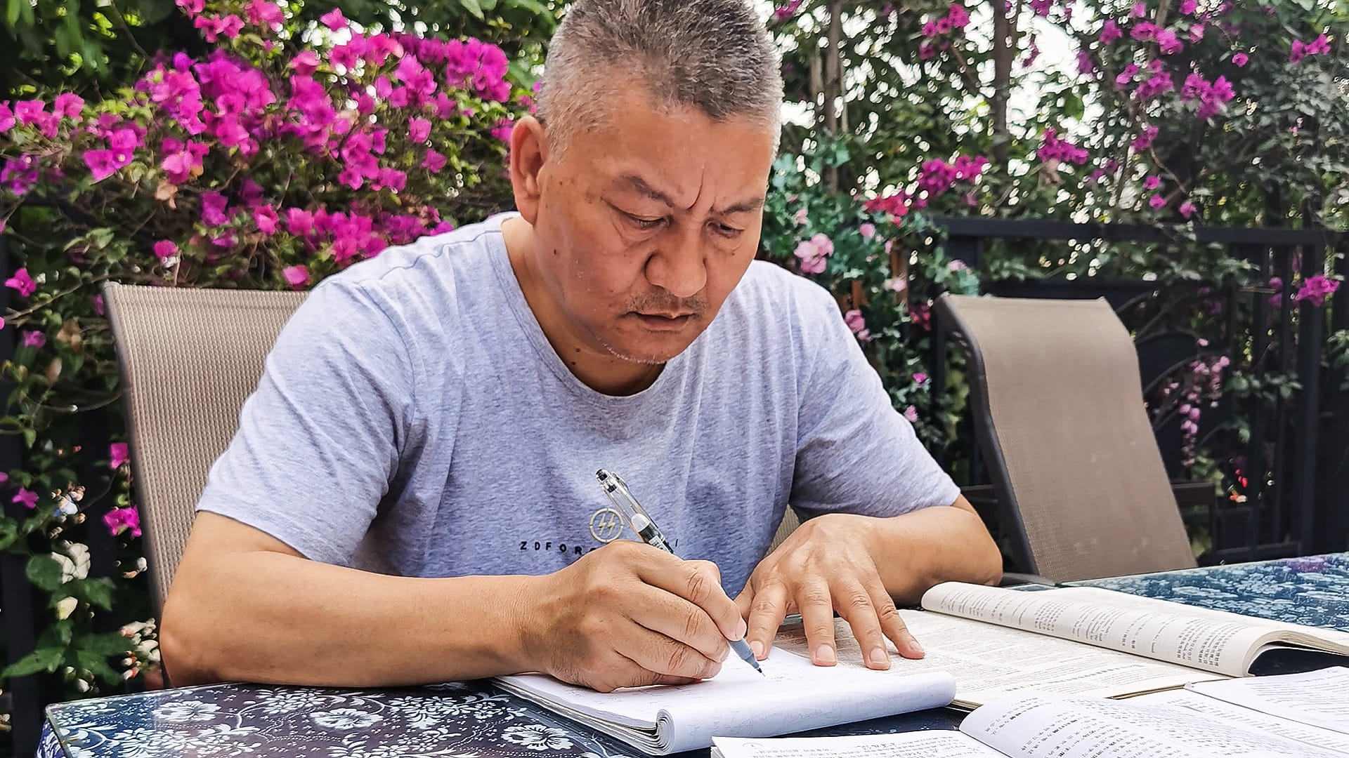 Image for the title: Self-made millionaire sits China's university exams for 27th time 