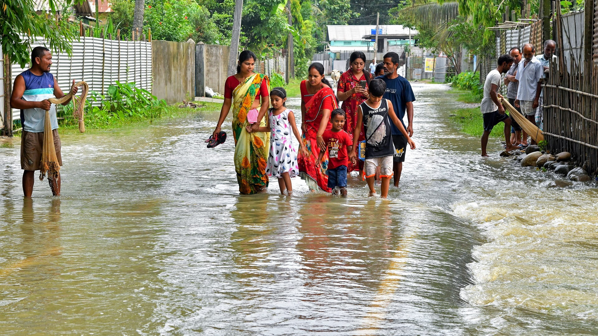 Image for the title: 19 dead, thousands seek shelter in South Asia monsoon floods 