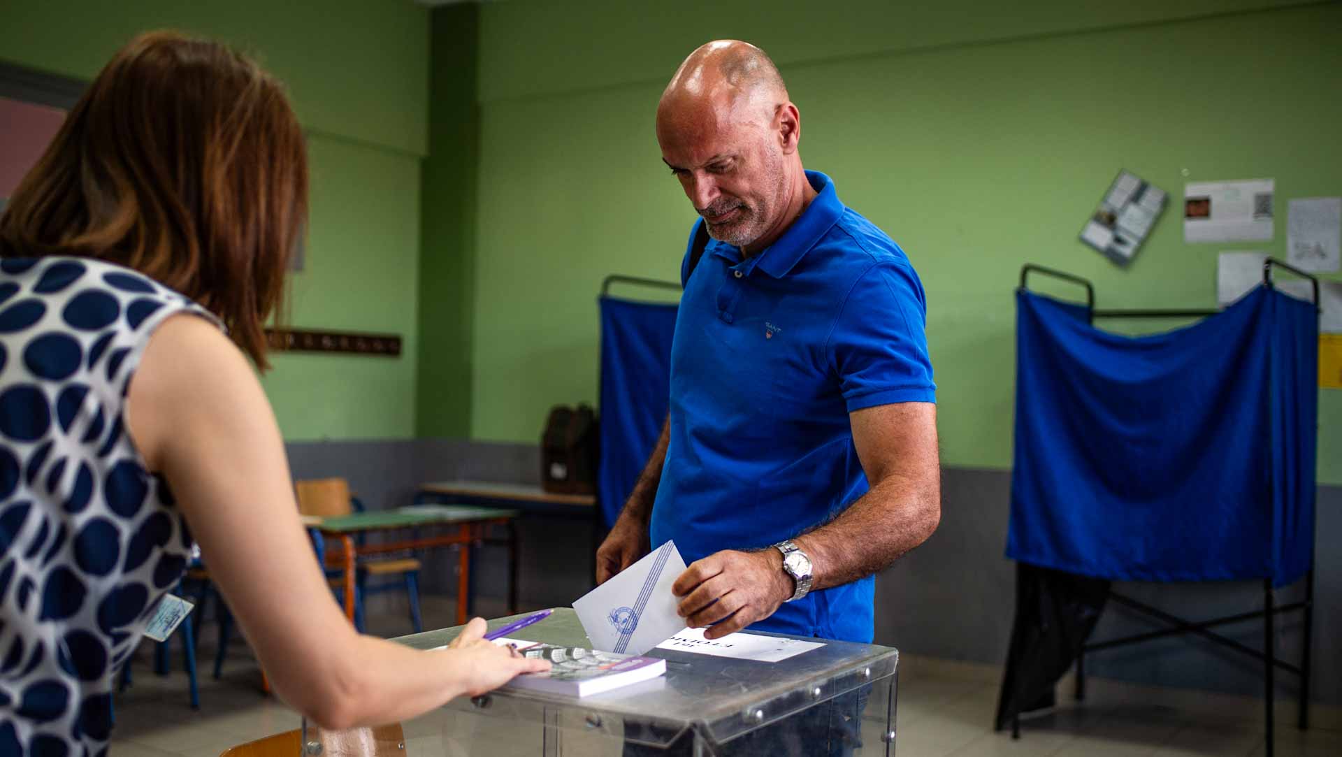 Image for the title: Polling stations open for Greece general election 