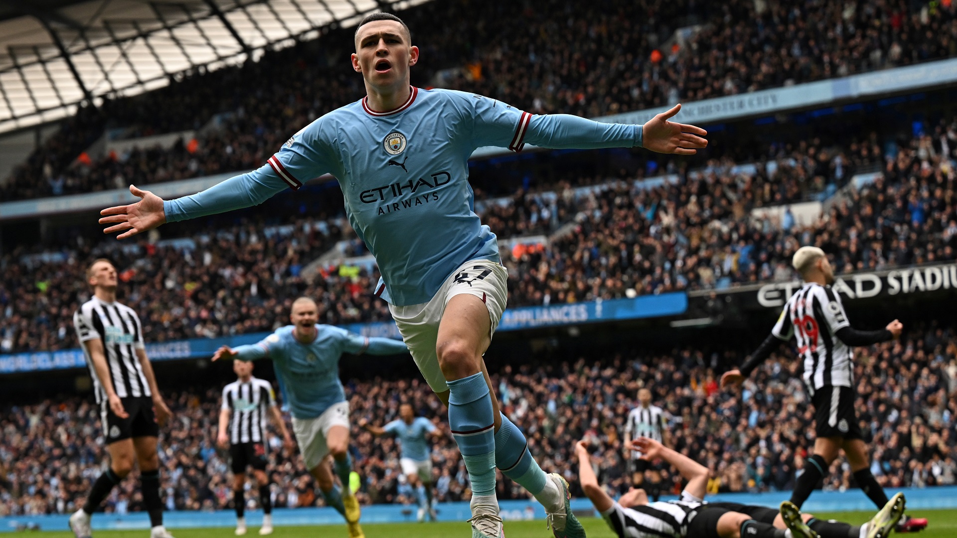 Image for the title: Man City beat Newcastle 2-0 to maintain pressure on Arsenal 