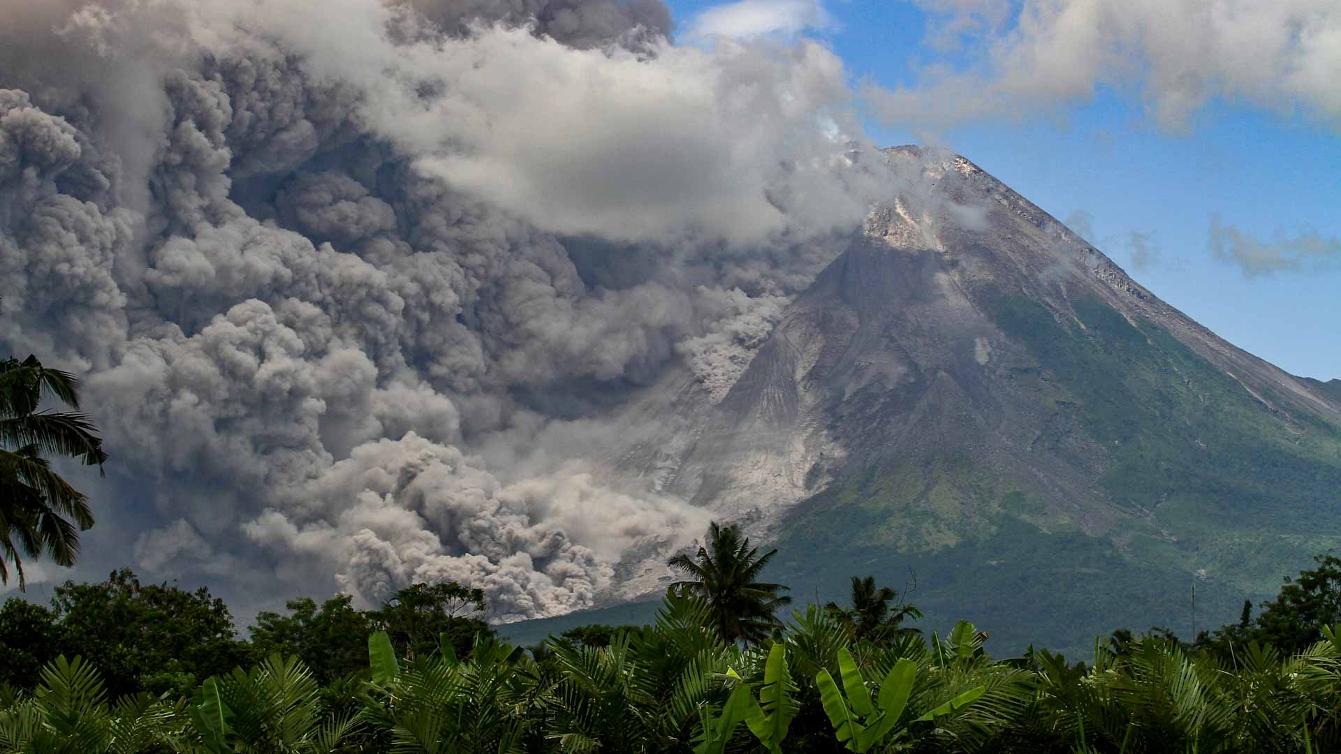 Image for the title: Indonesia's Merapi volcano erupts, covers villages in ash 