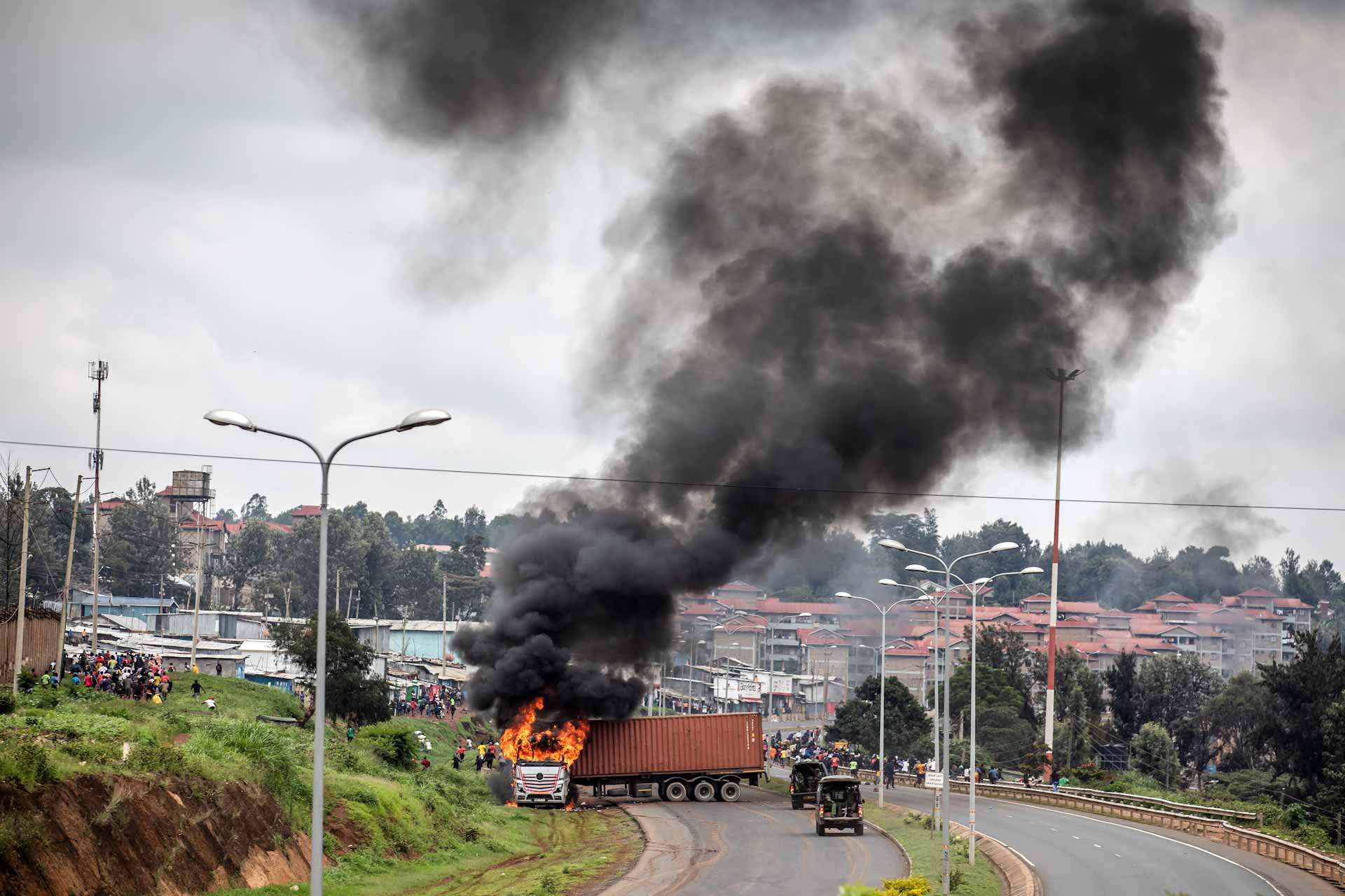Image for the title: Kenya police fire tear gas as opposition resumes protests 