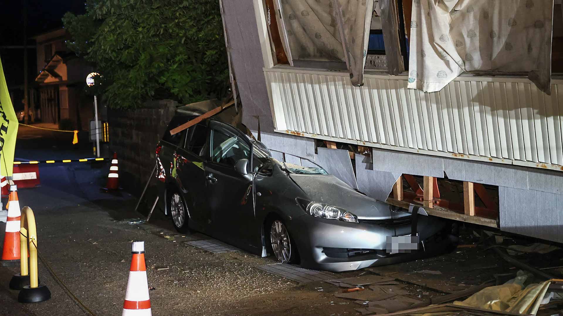 Image for the title: Strong earthquake kills one, destroys houses in Japan 