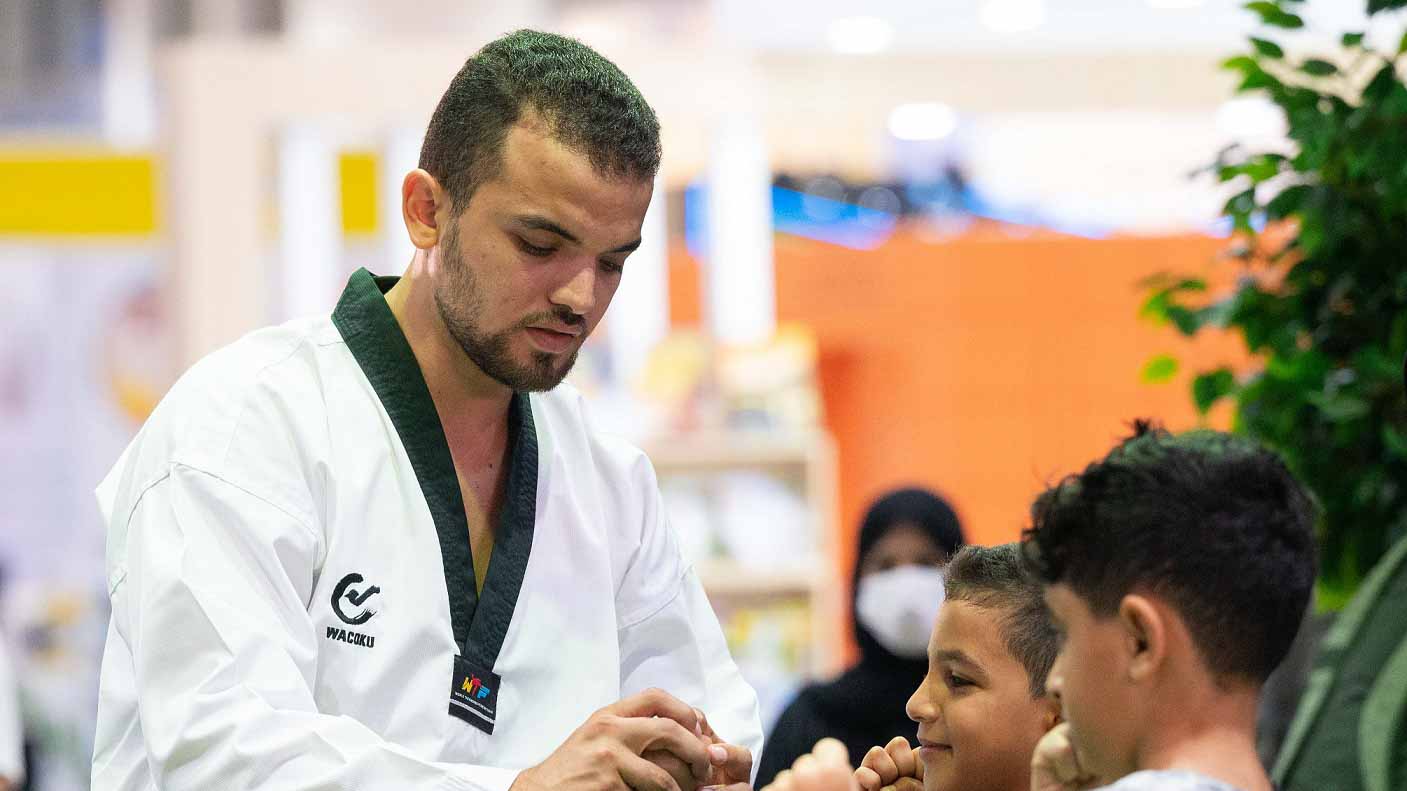 Image for the title: Kung-fu workshop at SCRF encourages young visitors  to train body 