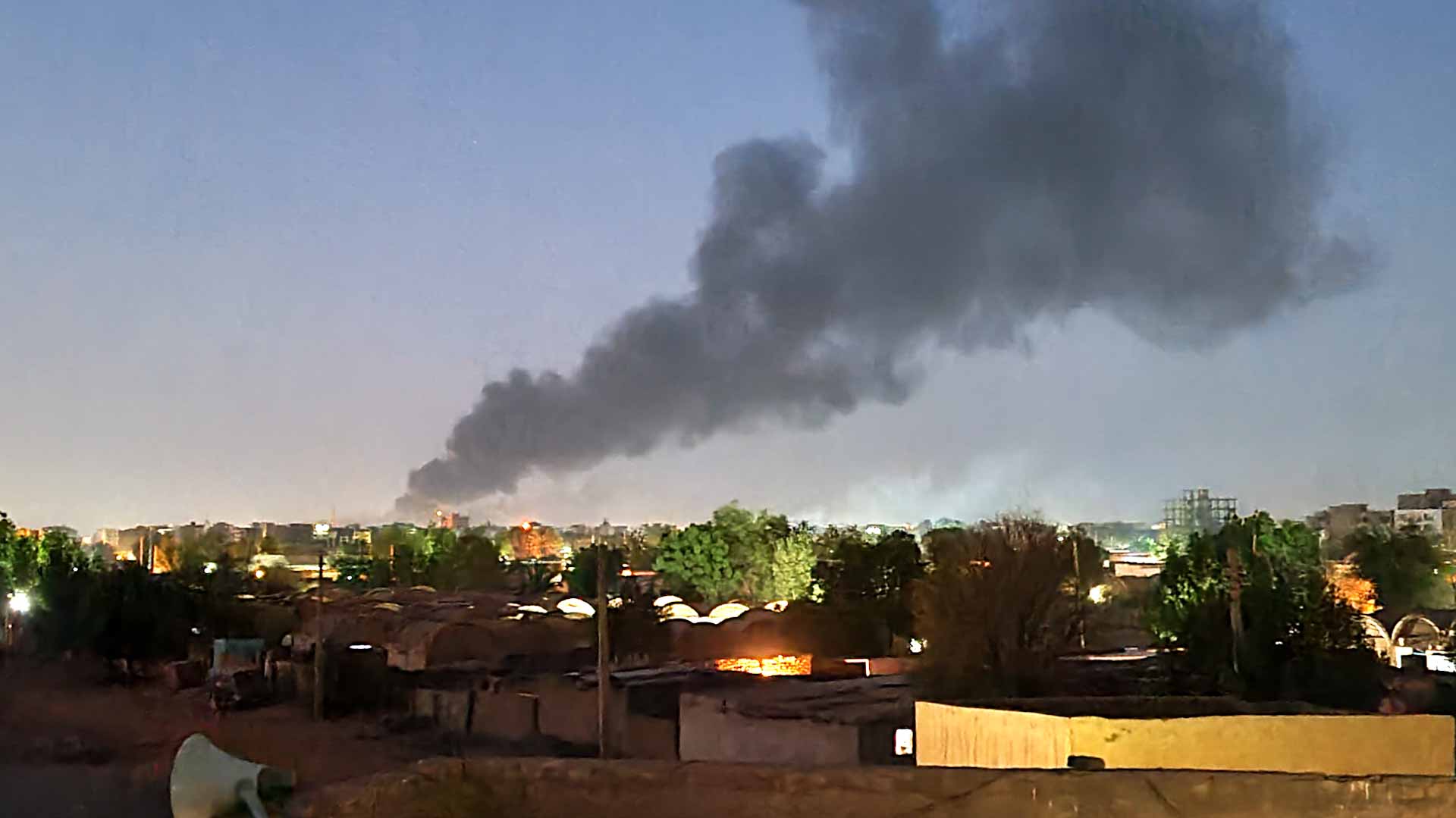 Image for the title: Sudan's capital rocked by loud explosions 