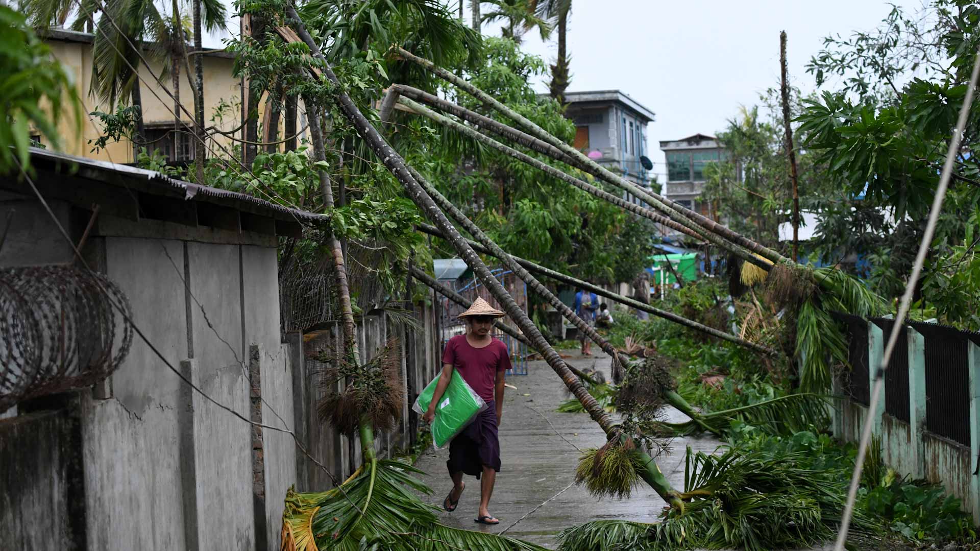 Image for the title: Myanmar port city slowly reopens after deadly Cyclone Mocha 