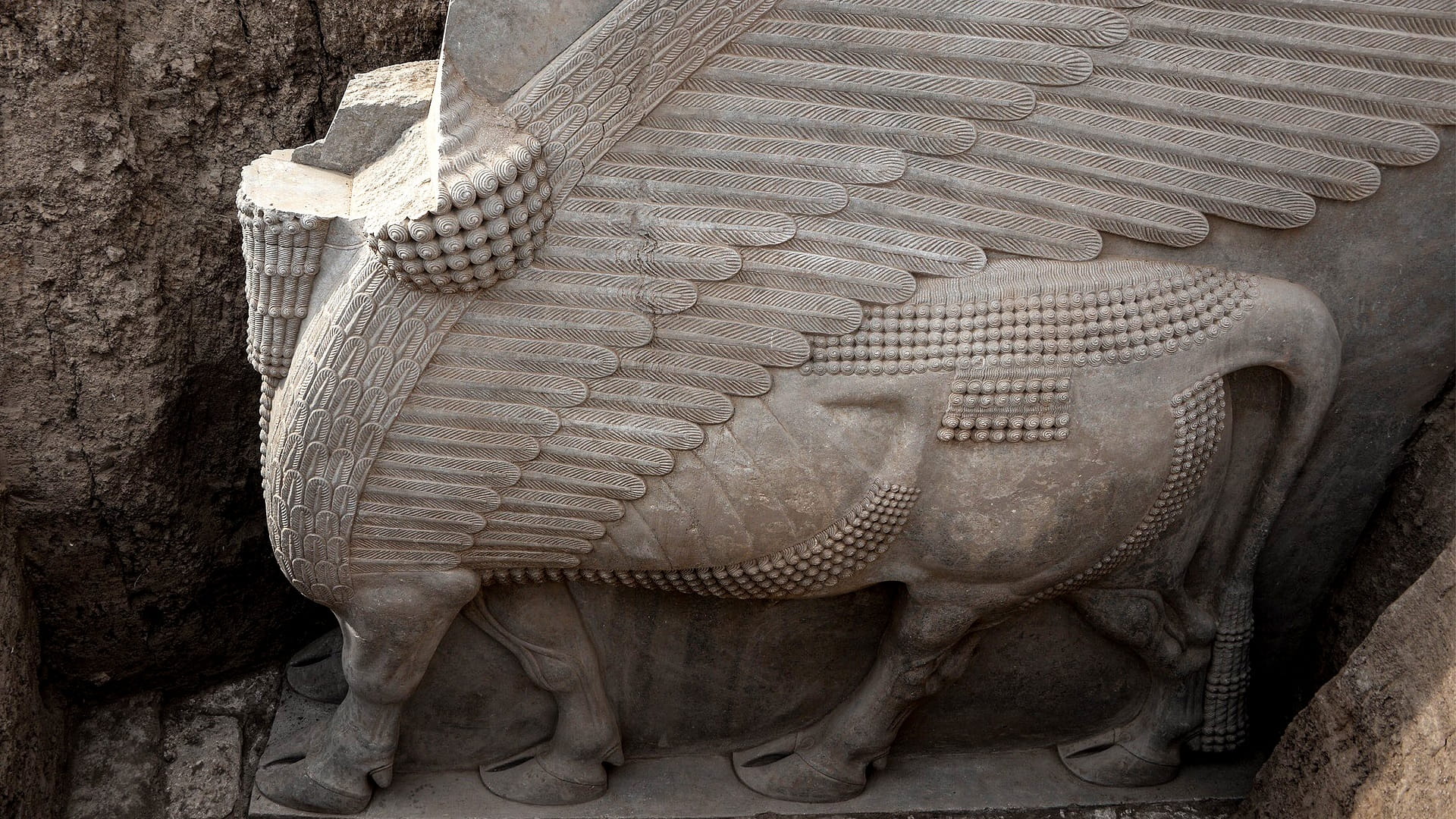 Image for the title: Iraq dig unearths 2,700-year-old winged sculpture largely intact 