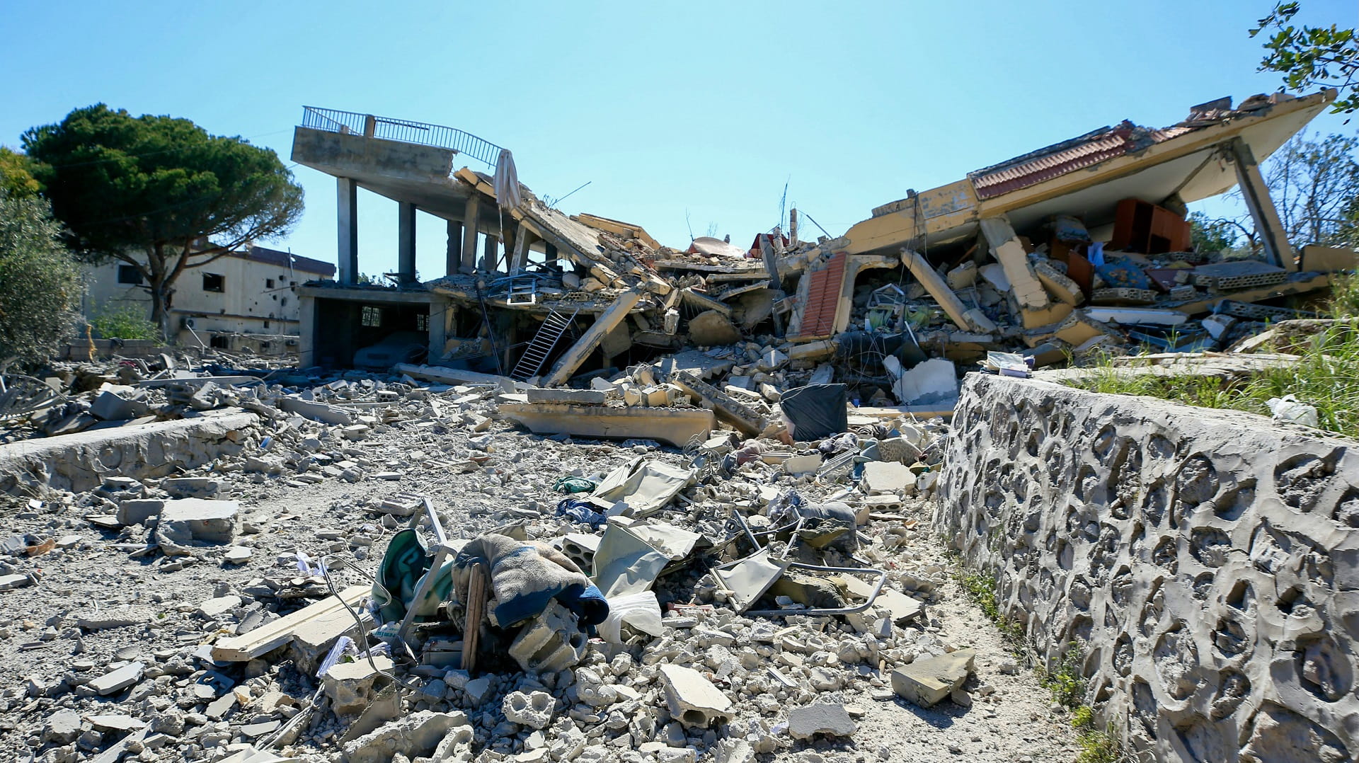 Image for the title: Lebanon's ‘Hezbollah’ targets Israel base, wounding 14 soldiers 