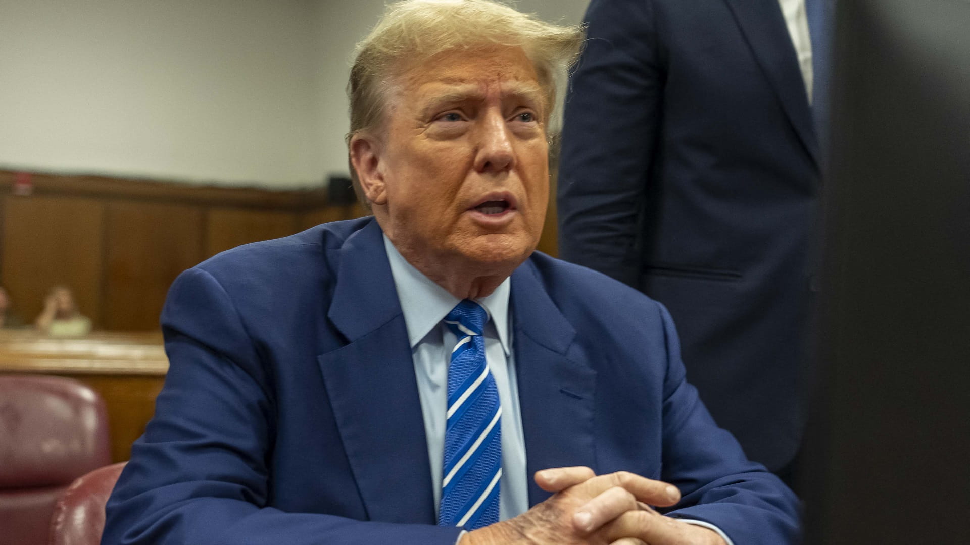 Image for the title: Trump due back in court as jury takes shape 