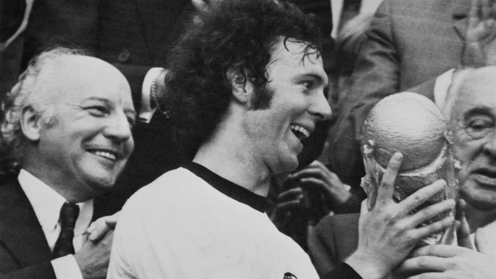 Image for the title: Bayern to honour Beckenbauer with statue outside stadium 