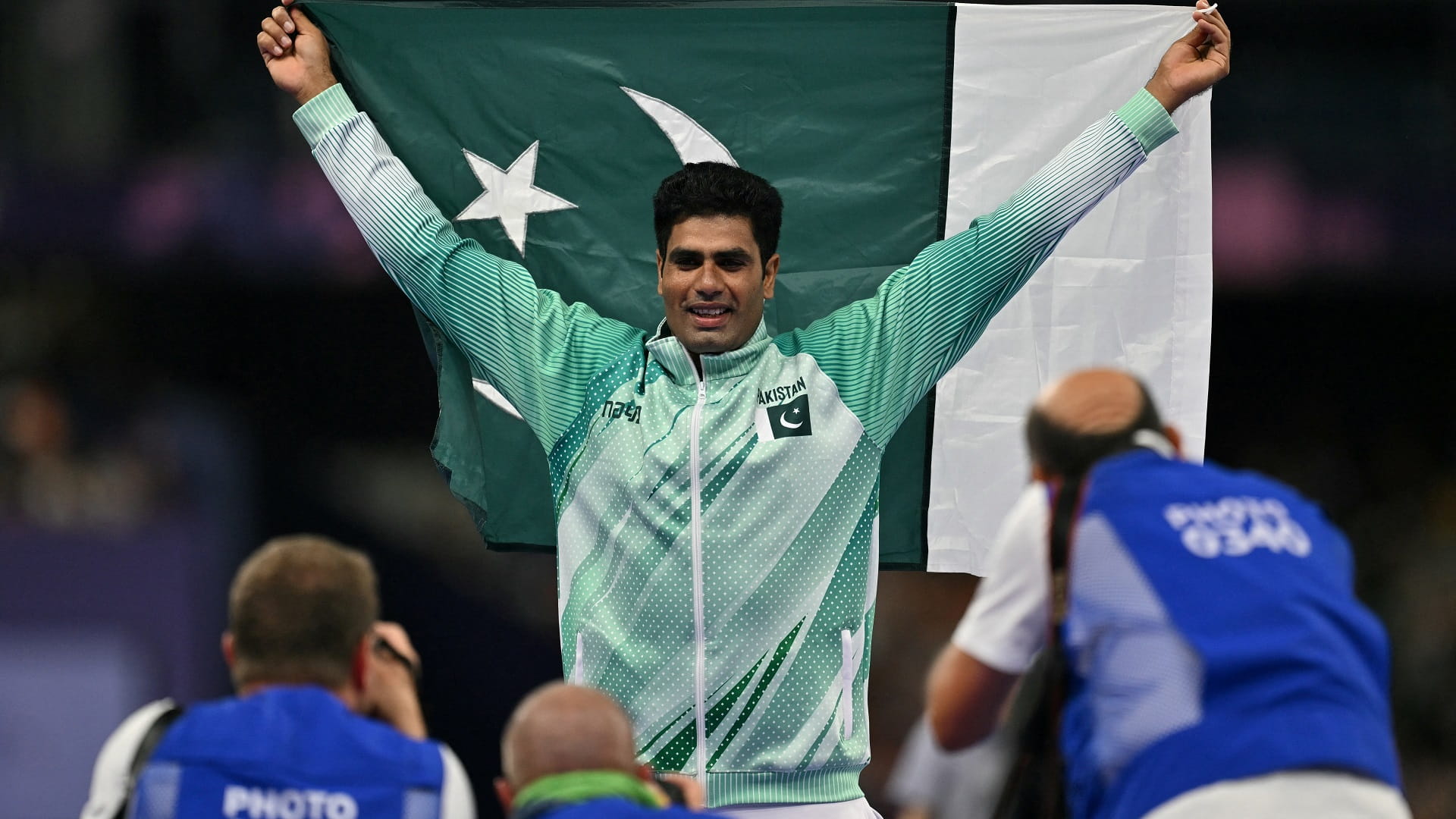 Image for the title: Joy in Pakistan village as local hero Nadeem spears Olympic gold 