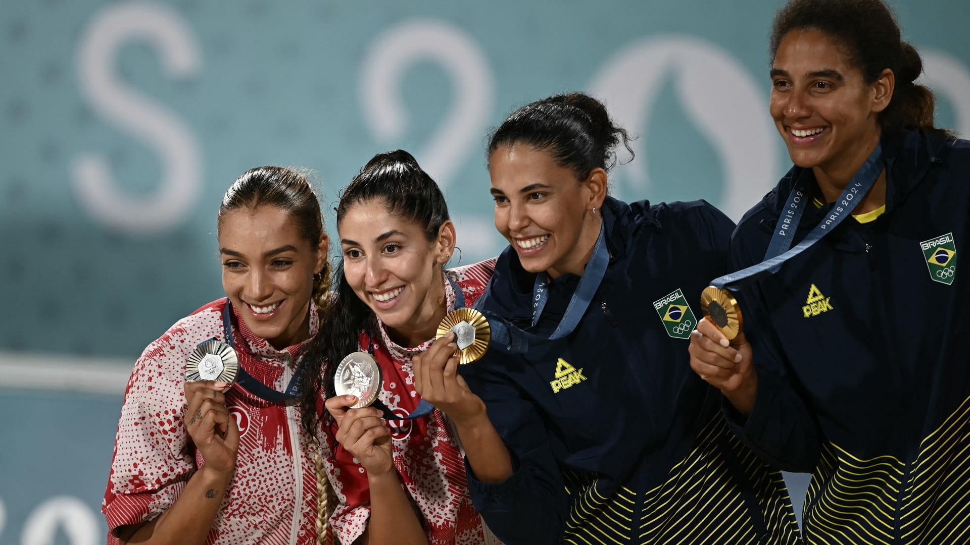 Image for the title: Brazil wrestle to women's gold in Olympic beach volleyball 