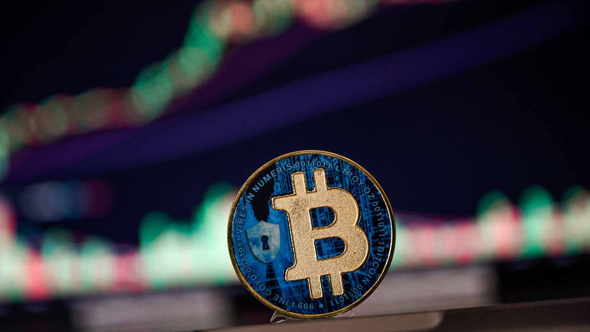 Image for the title: Bitcoin breaks $100,000, outshining wavering stock markets 