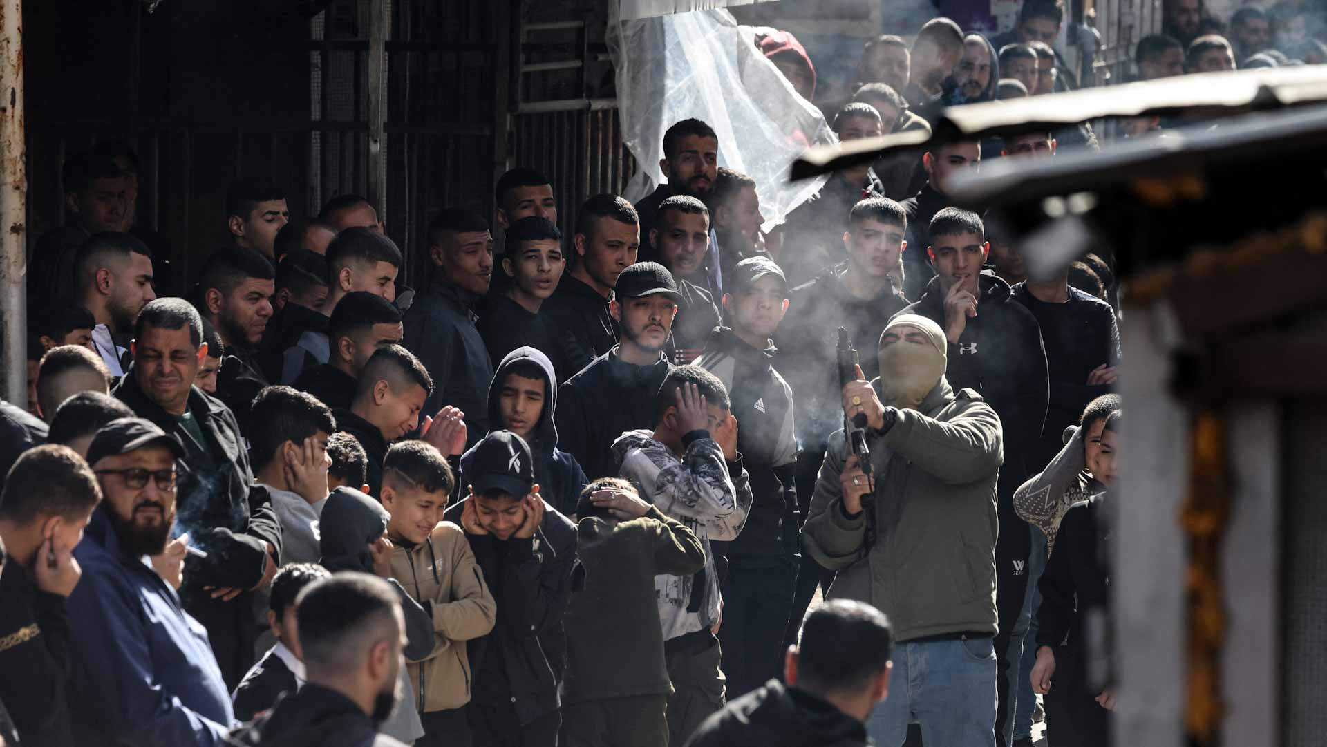 Image for the title: Palestinian forces exchange gunfire with militants in West Bank 
