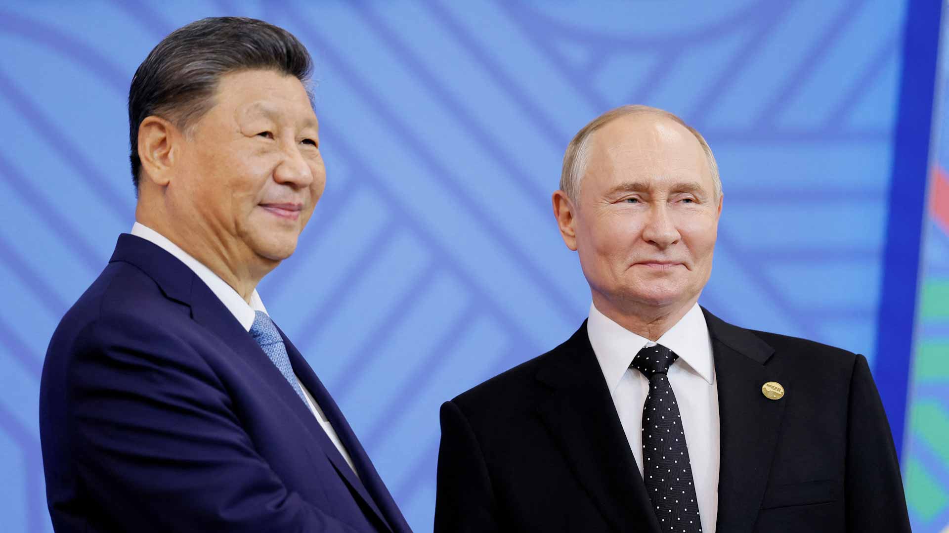 China, Russia always moving forward 'hand in hand', Xi tells Putin