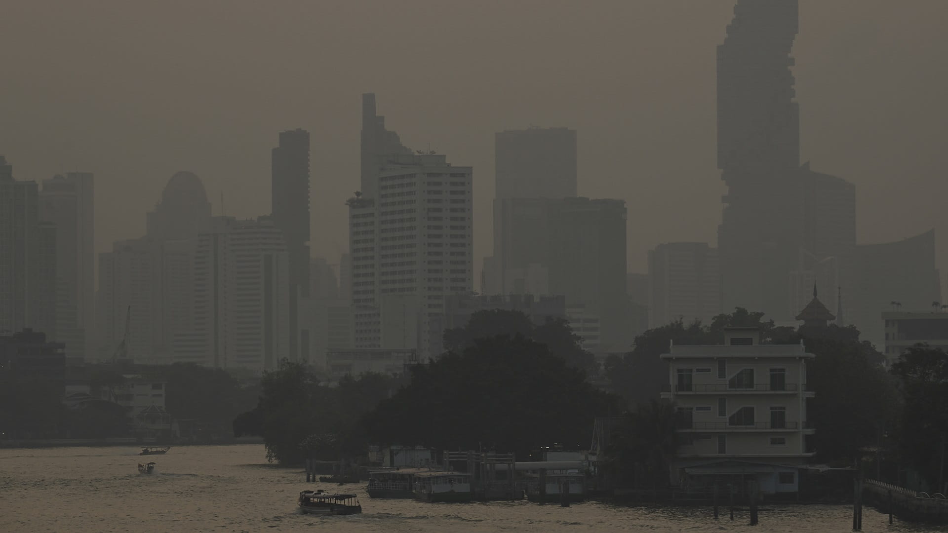 Image for the title: Bangkok says work from home as pollution blankets city 