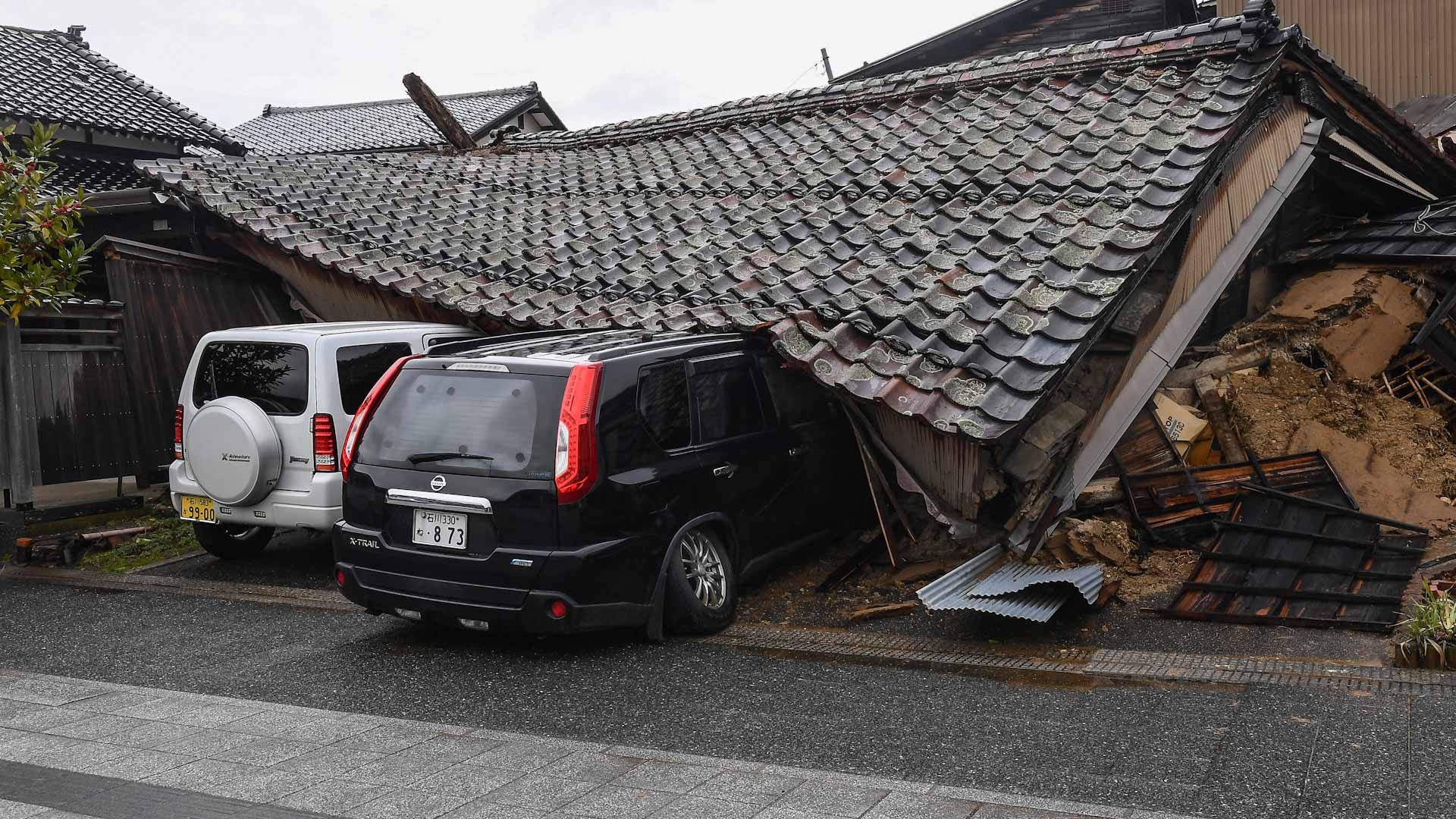 Image for the title: Woman in 90s pulled from rubble five days after Japan quake 
