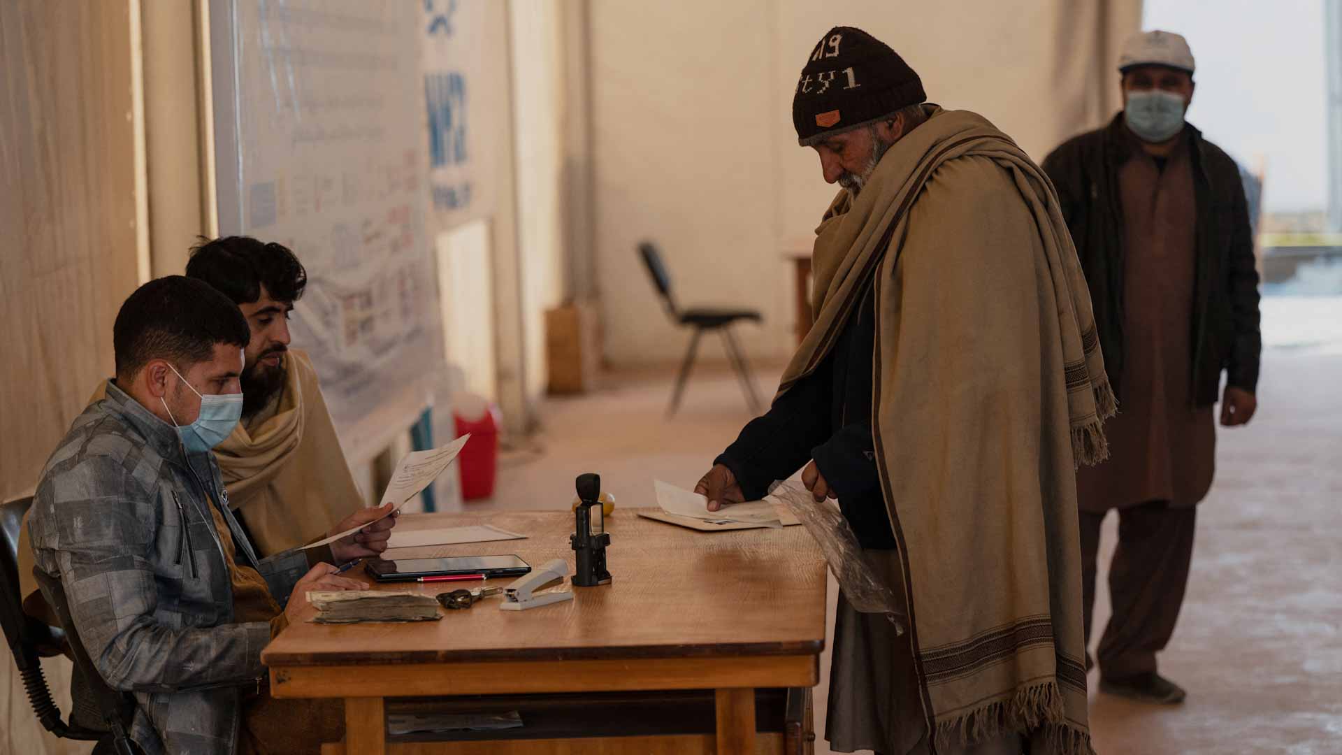 Image for the title: Millions of Afghans go hungry as winter cold bites 