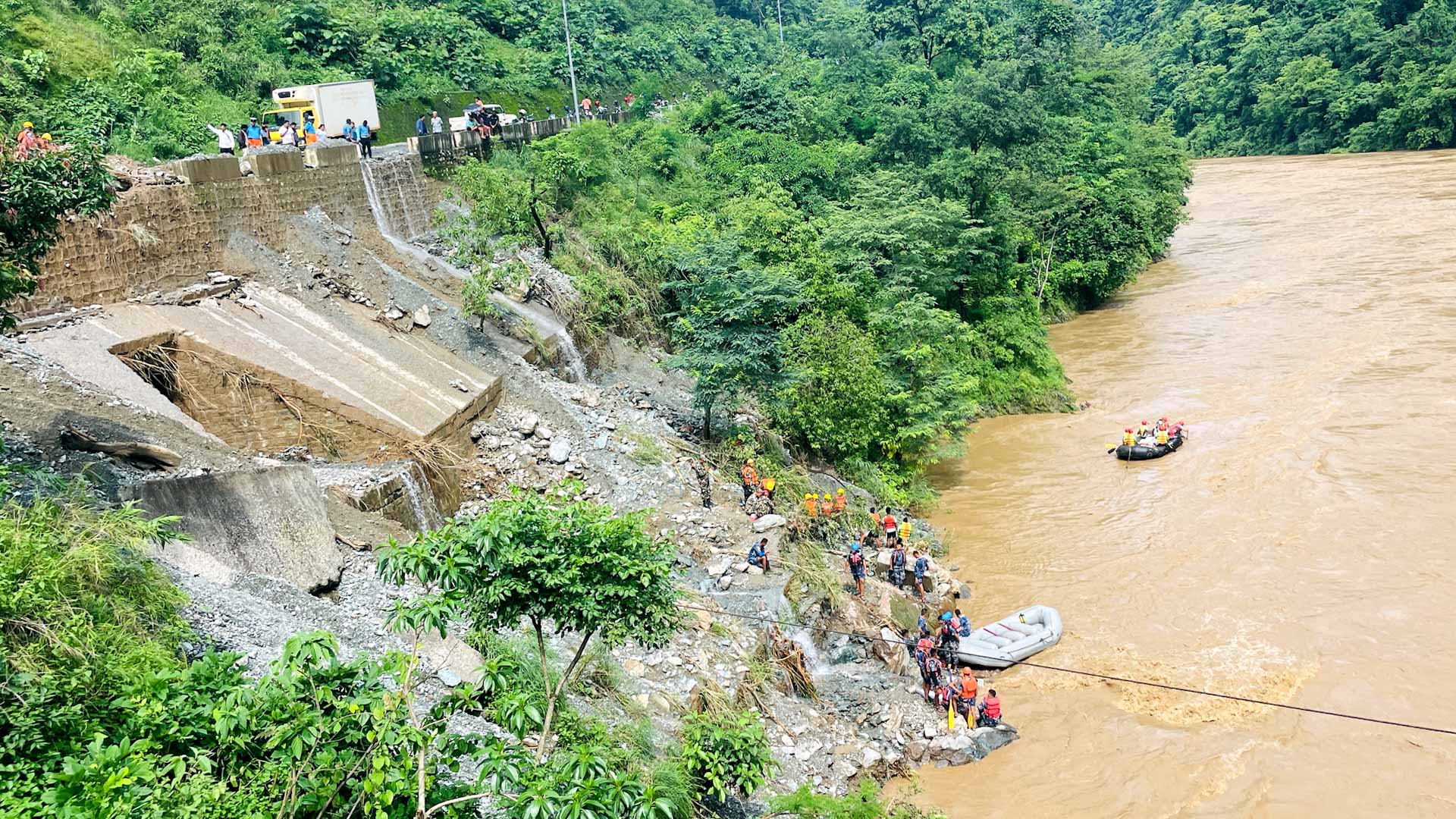 Image for the title: Nepal retrieves more bodies from buses swept away by landslide 