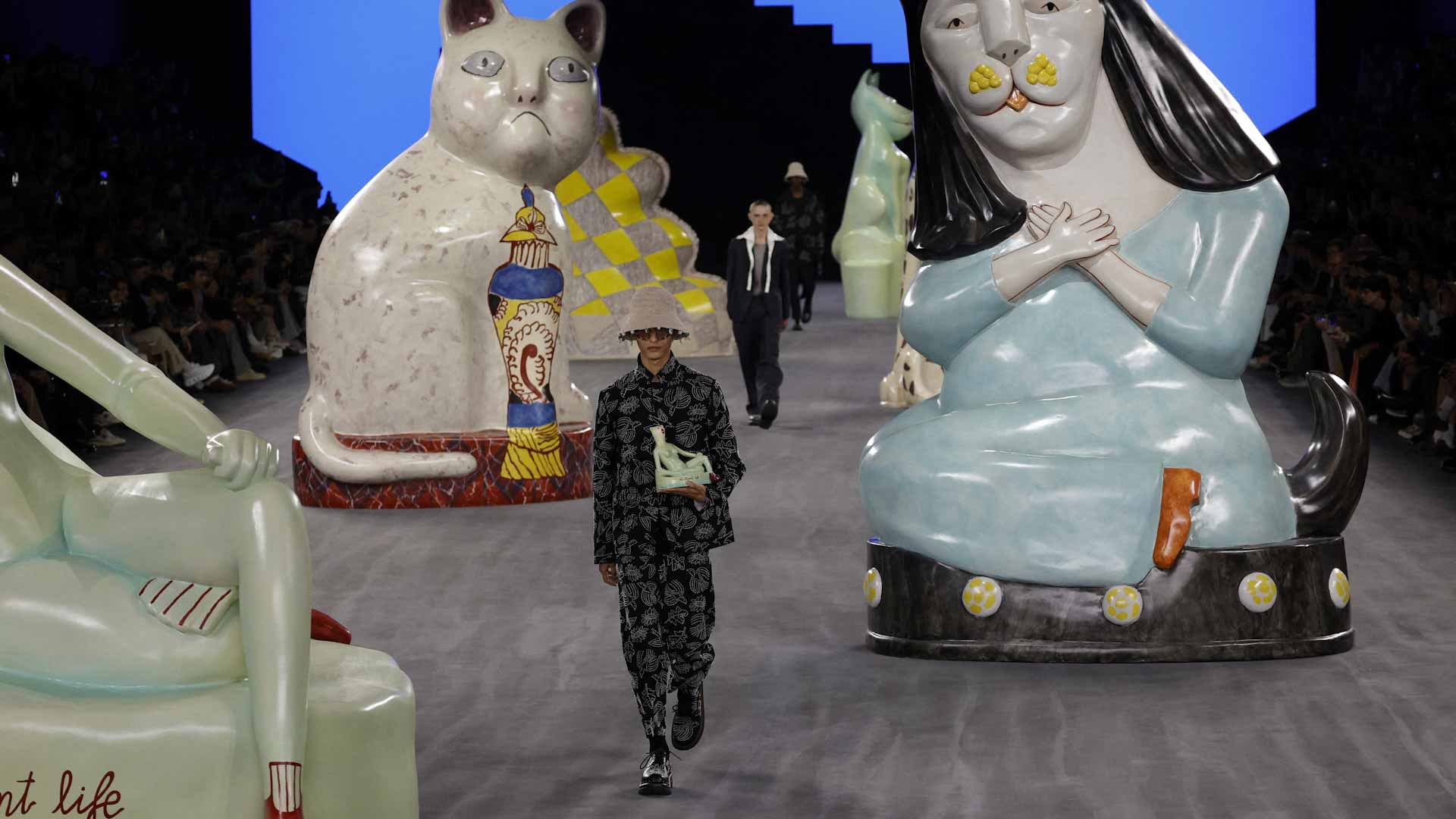 Image for the title: Dior offers laid-back style on a feline cat-walk 