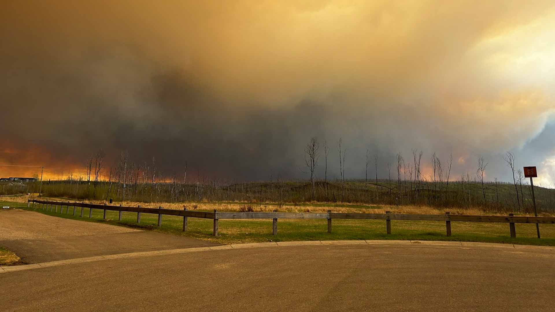 Image for the title: Canada prisoners relocated as hundreds flee wildfires 