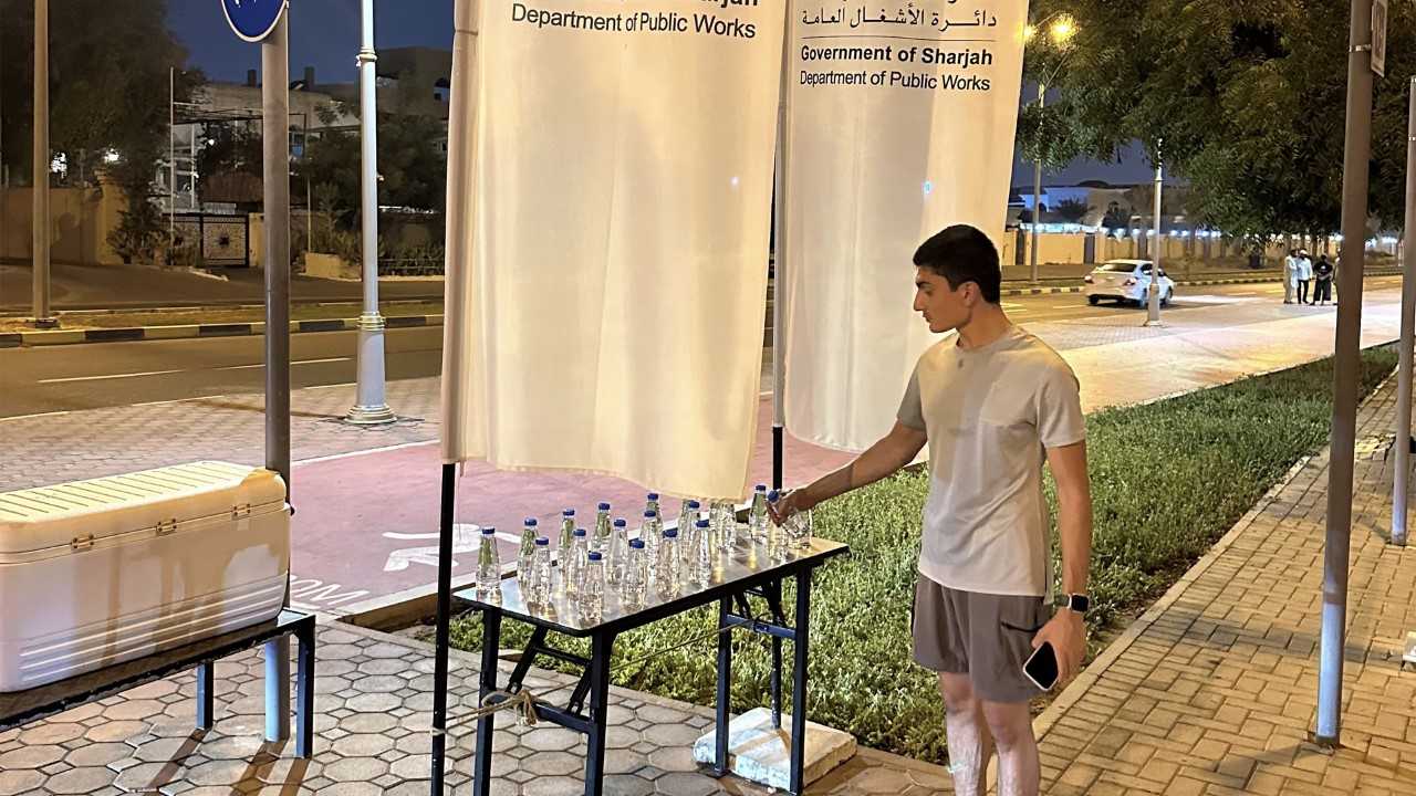 Image for the title: SDPW's 'Enjoy Summer with Us' provides runners with water  