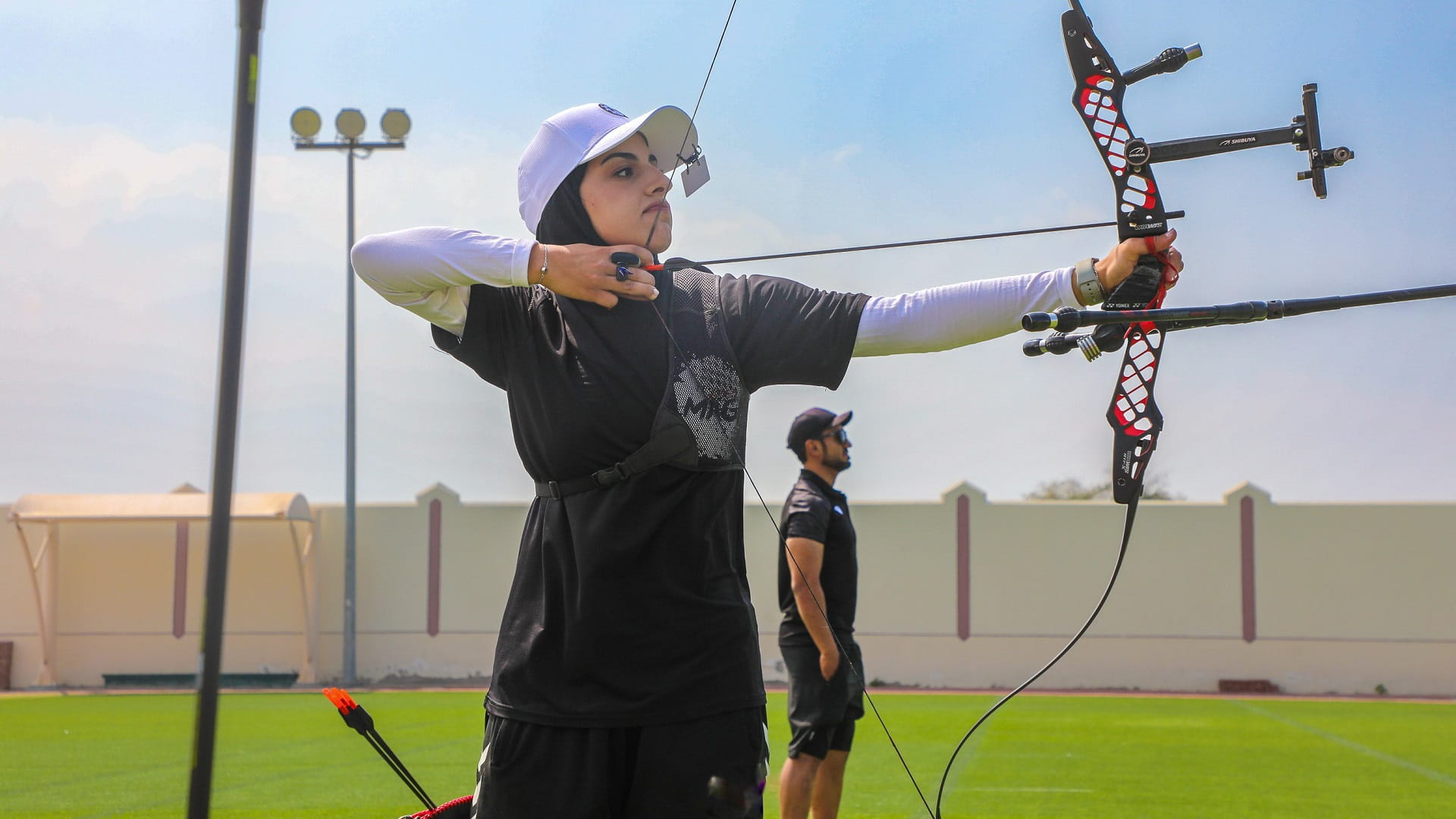 Image for the title: Al Hamriyah archery player Aisha Al Ali to train in Switzerland 