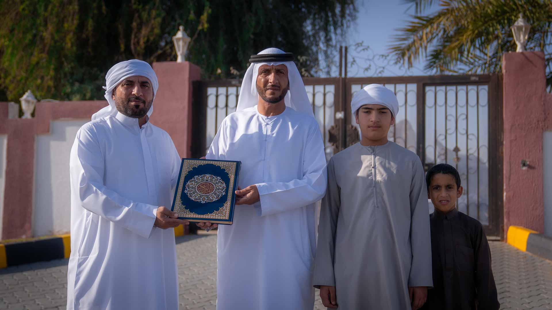 Image for the title: Mleiha Forum distributes the Noble Quran to families in Mleiha 
