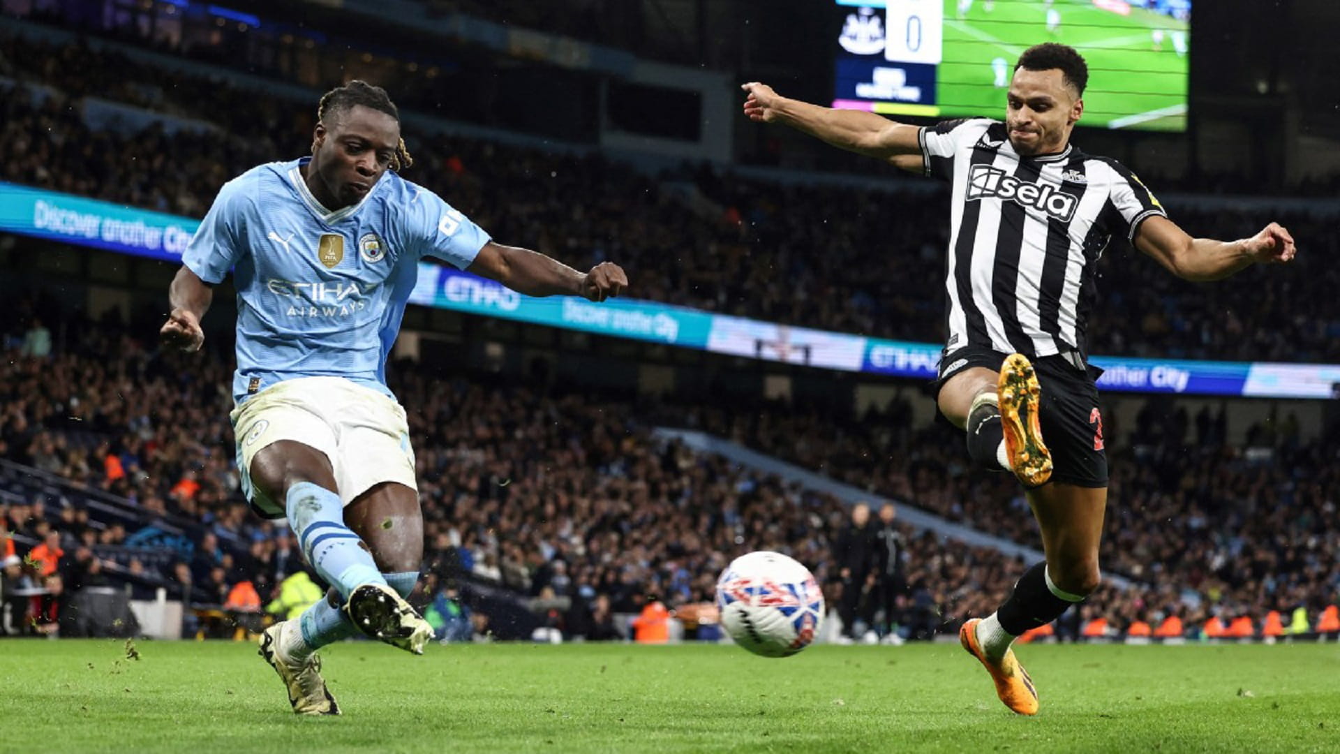 Image for the title: Man City go into FA Cup semis after 2-0 win over Newcastle 