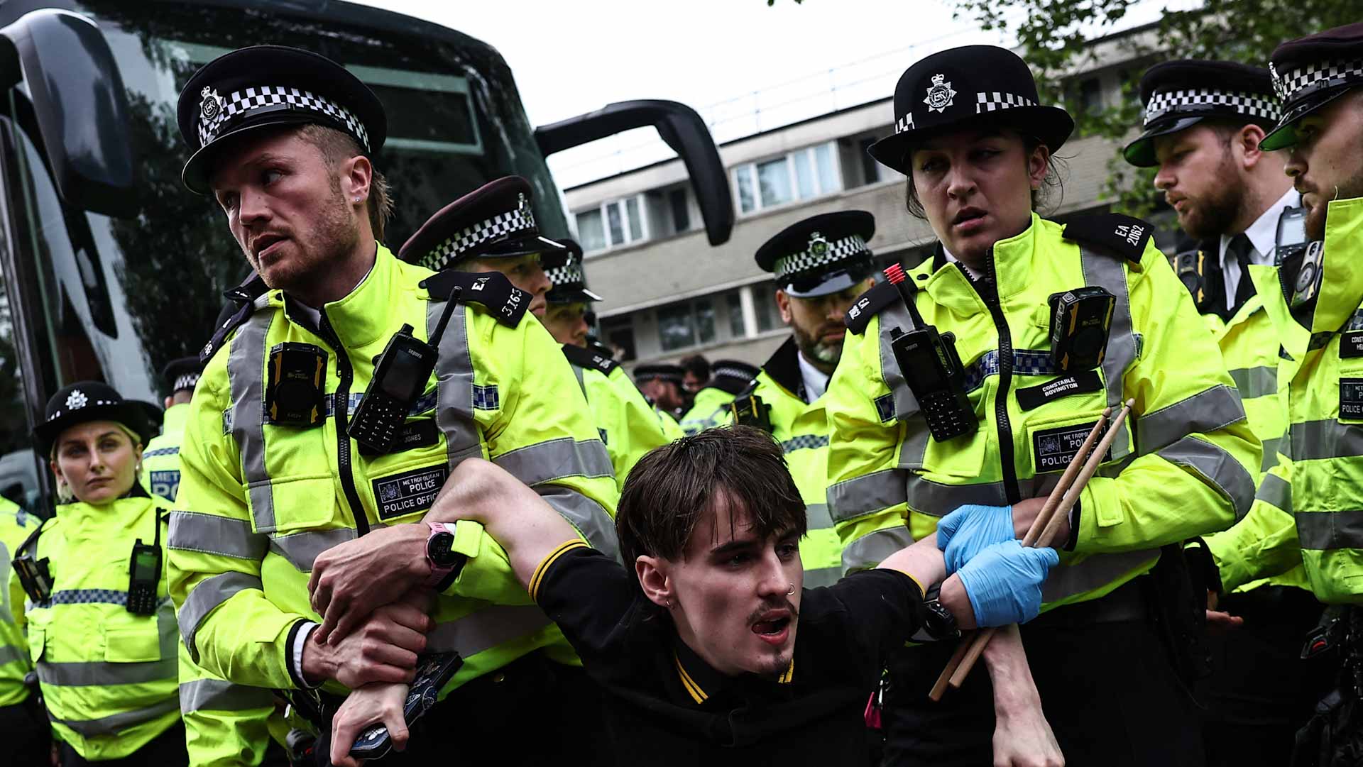 Image for the title: UK police arrest 45 at protest against migrant removals 