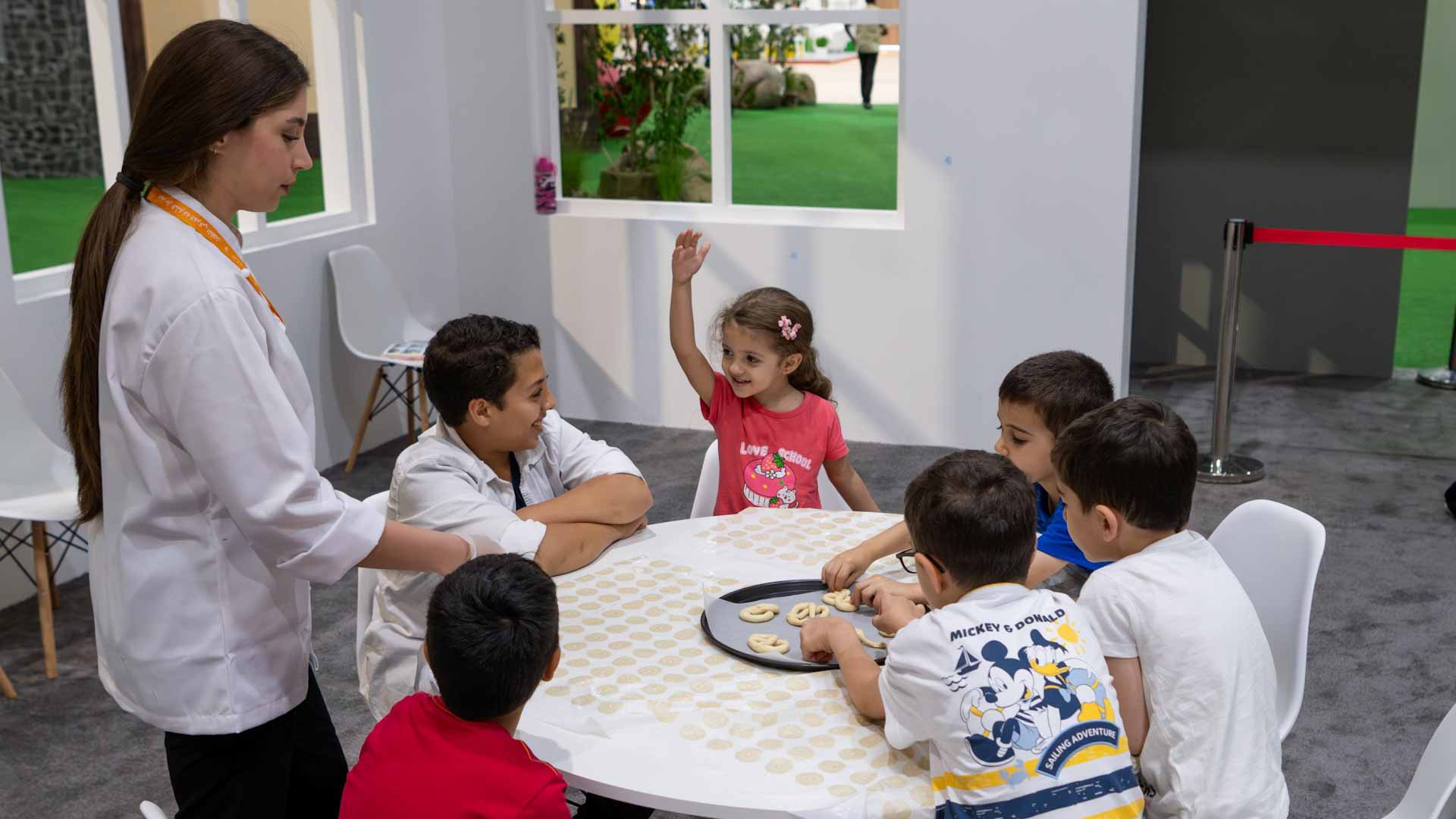 Image for the title: Young chefs pour their ingenuity into customised pretzels at SCRF 