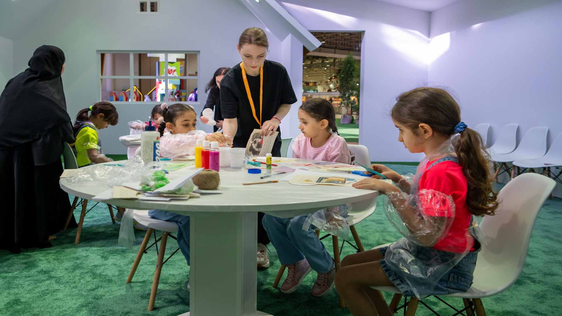 Image for the title: SCRF 2024: Children glow in creativity making paper flowers 