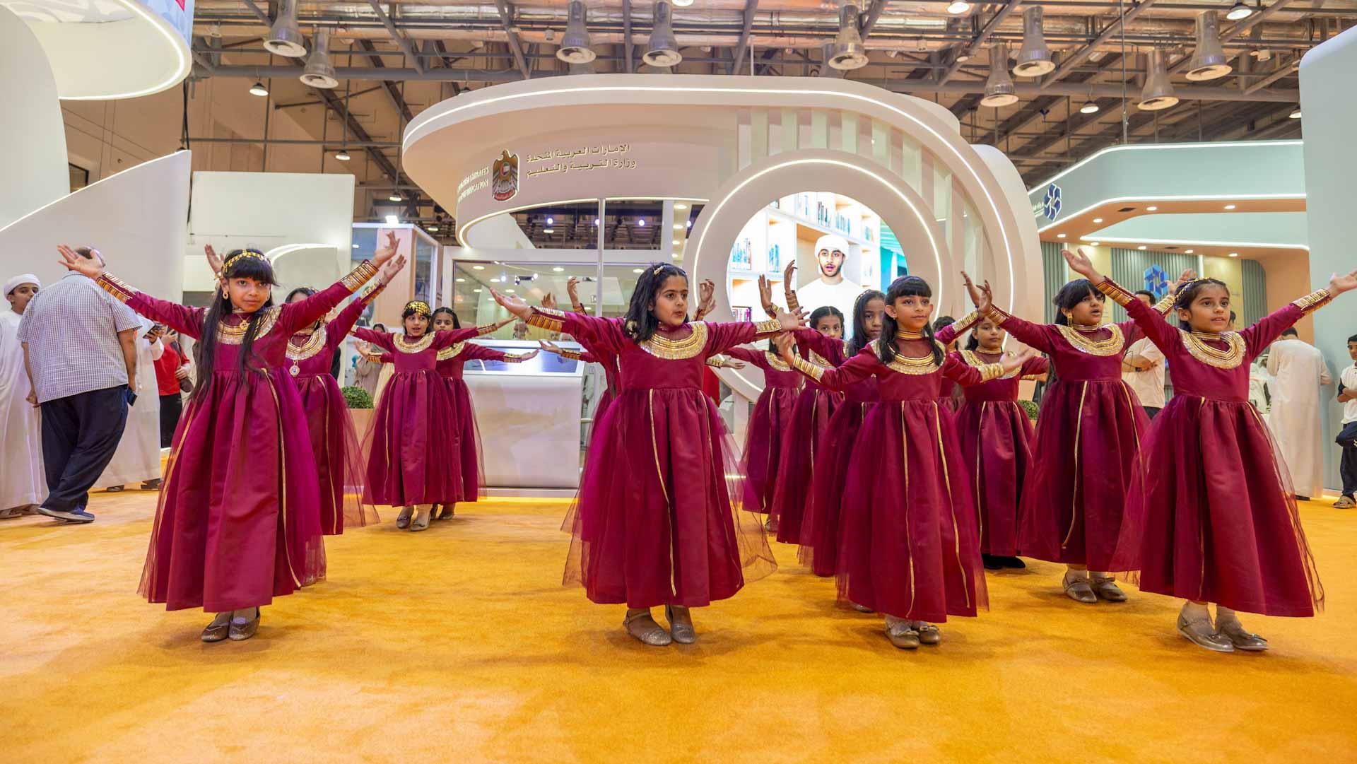 Image for the title: UAE schoolgirls carry forward Emirati folk traditions at SIBF 