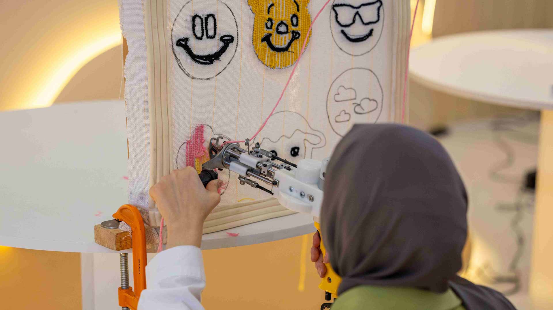 Image for the title: Forget screens… embroidery keeps children on their toes at SIBF 