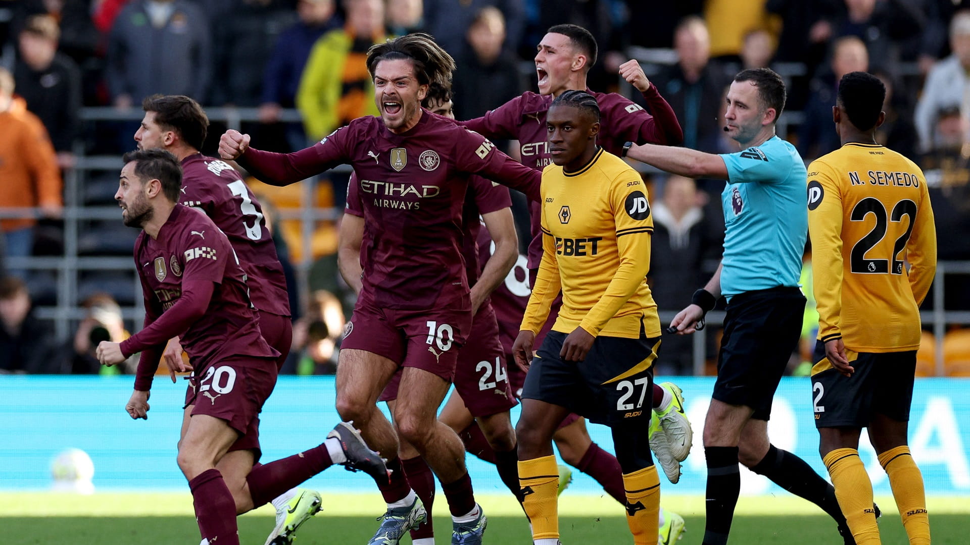 Stones bags controversial winner as Man City survive Wolves scare 