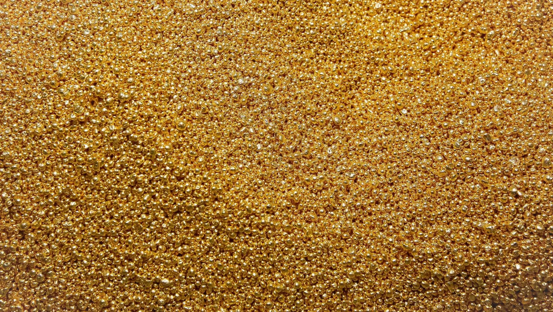 Gold inches higher as investors eye US data for rate cues 