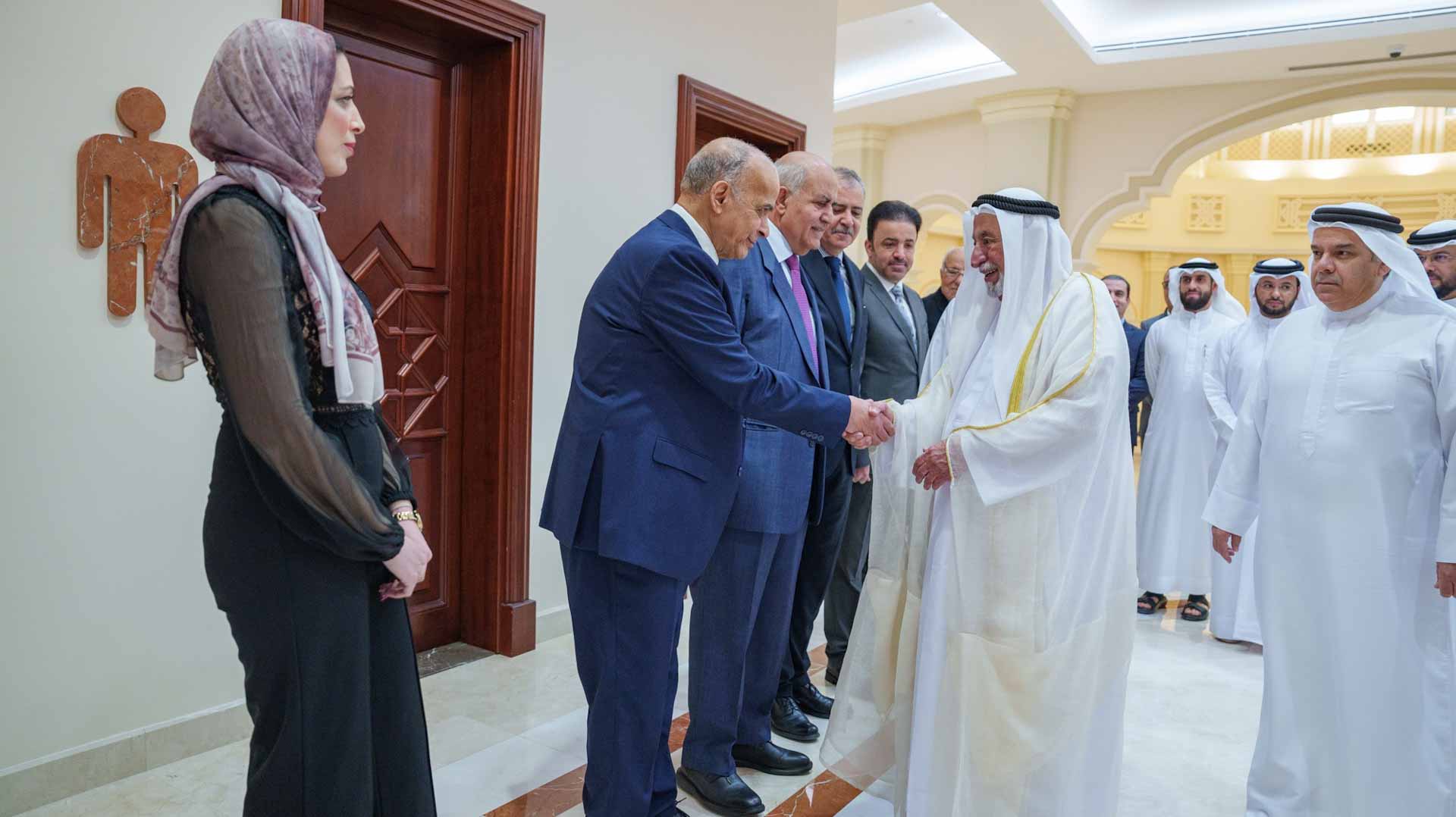 Sharjah Ruler shakes hands with the attendees
