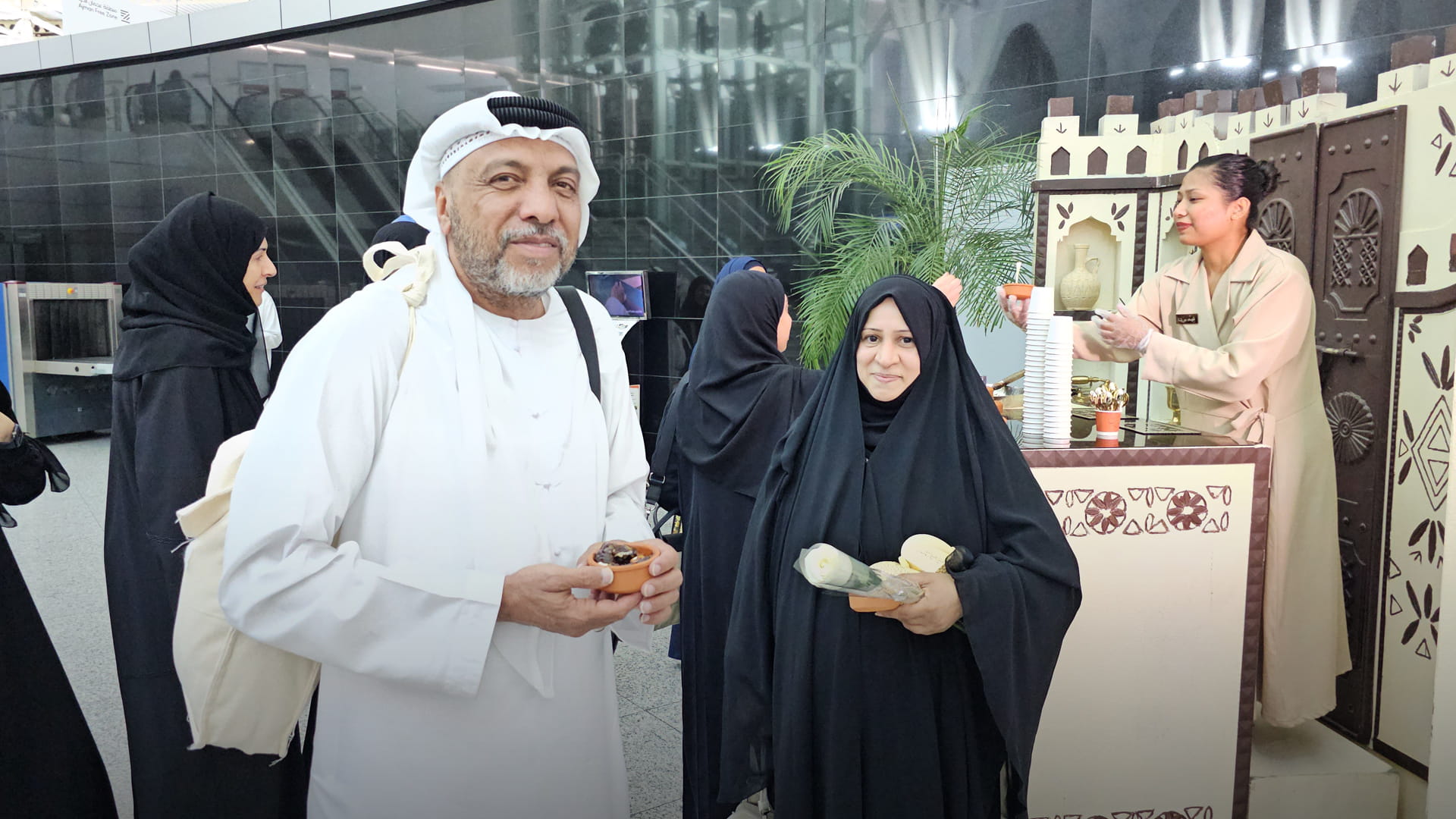 Sharjah Airport receives pilgrims with flowers