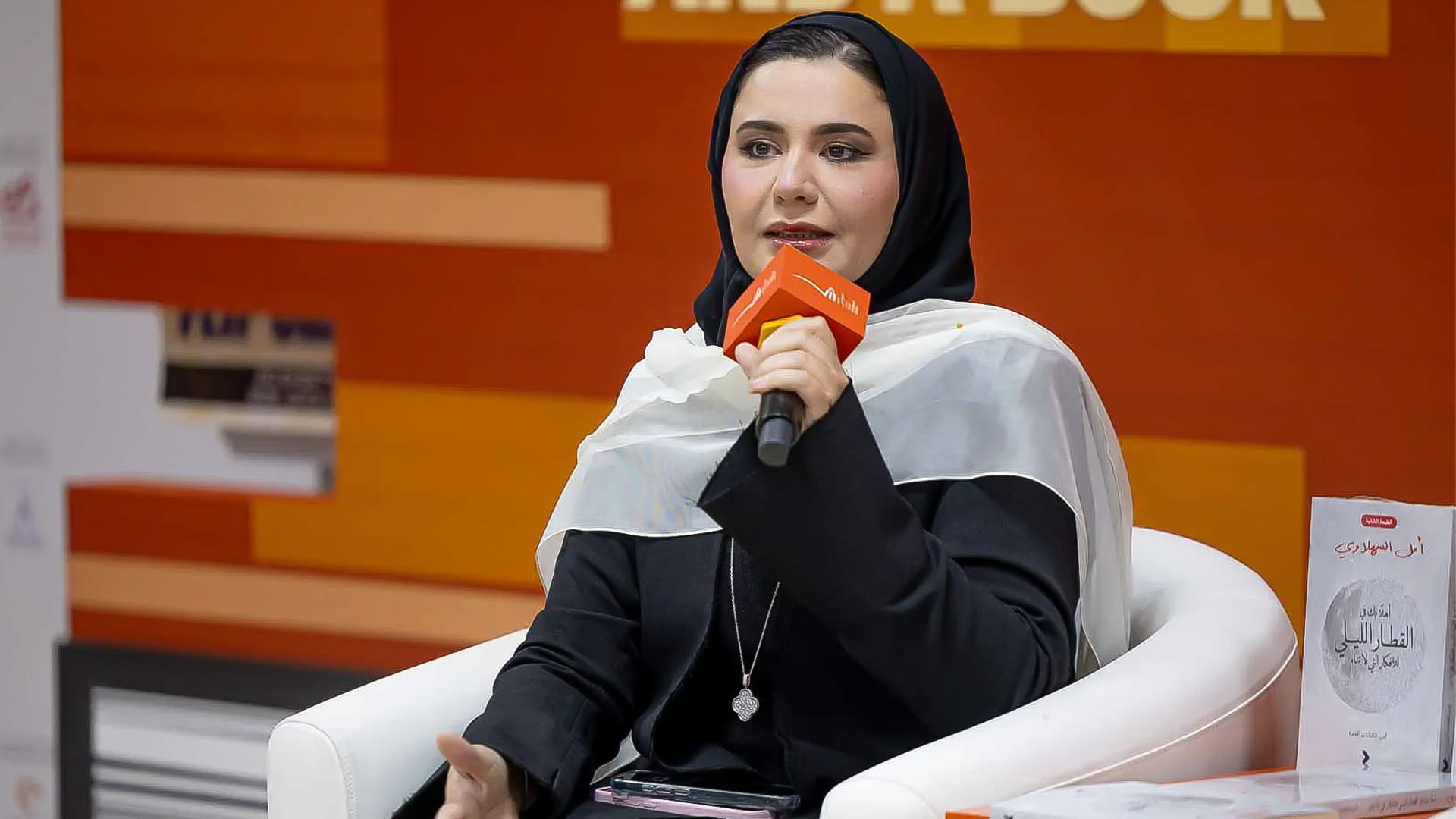 Image for the title: Emirati poet Amal Al Sahlawi captivates audiences at SIBF 