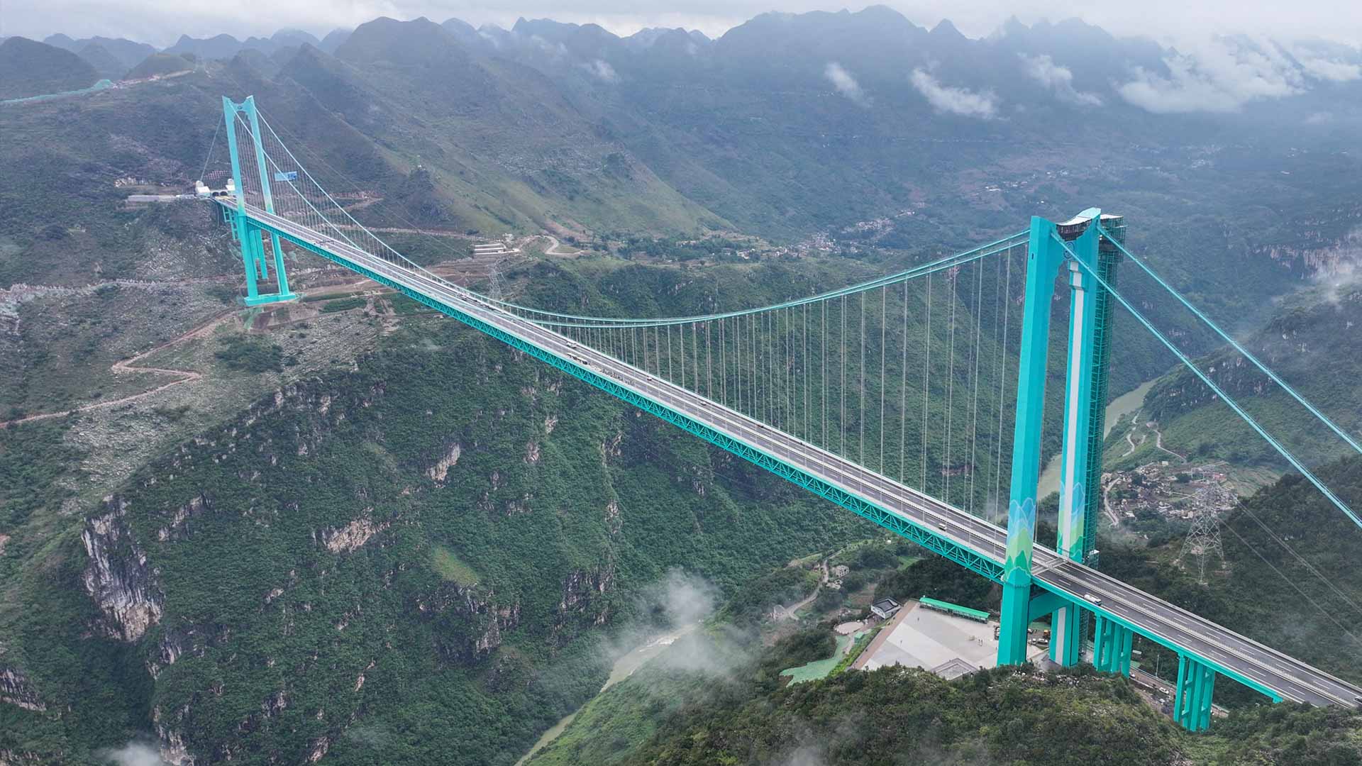 Image for the title: World's highest bridge opens to traffic in China 