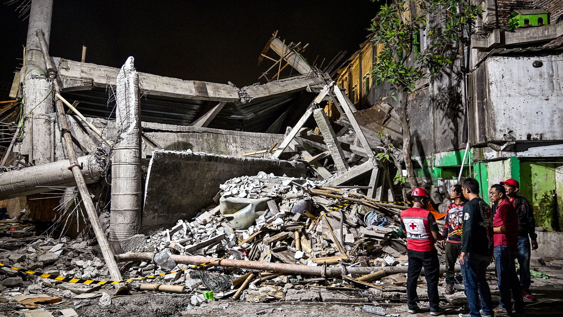 Indonesia school building collapse kills one, injures dozens 