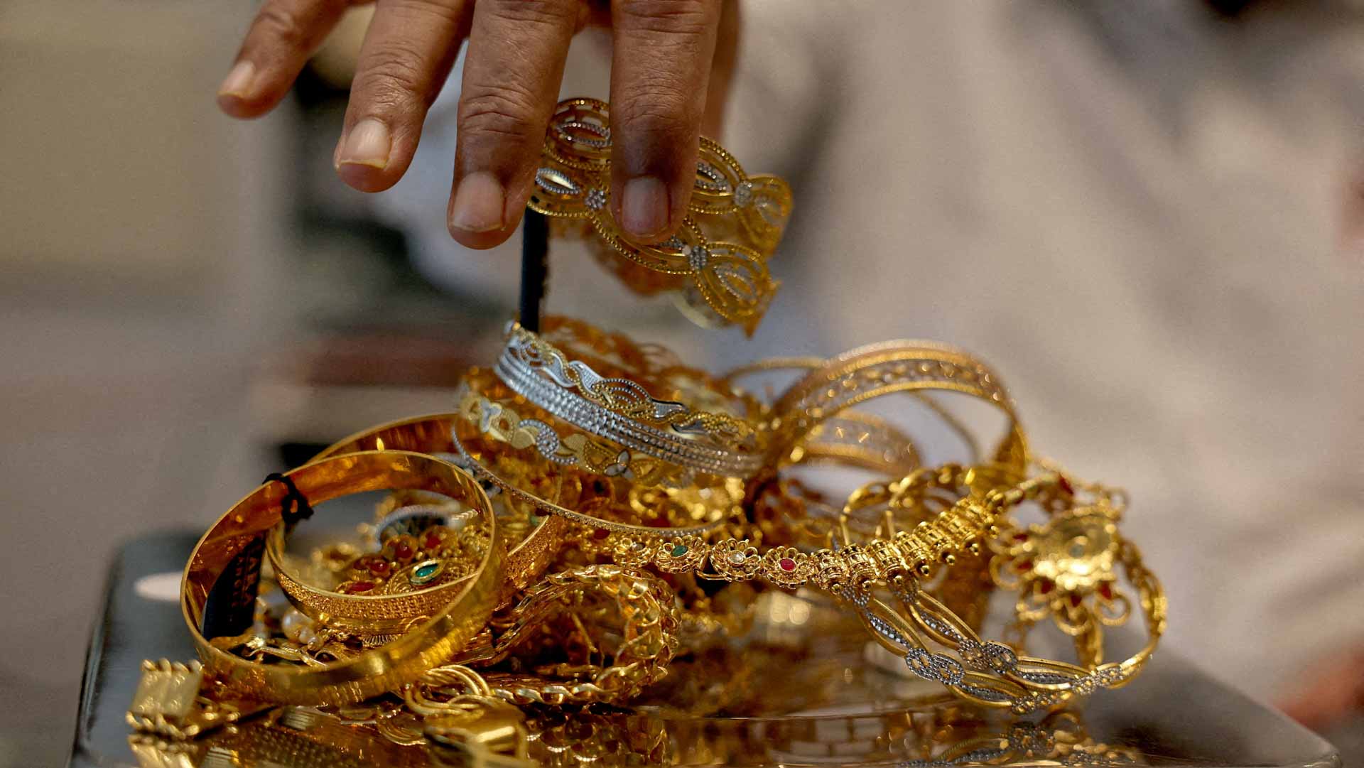 Gold declines as stronger dollar weighs on prices 