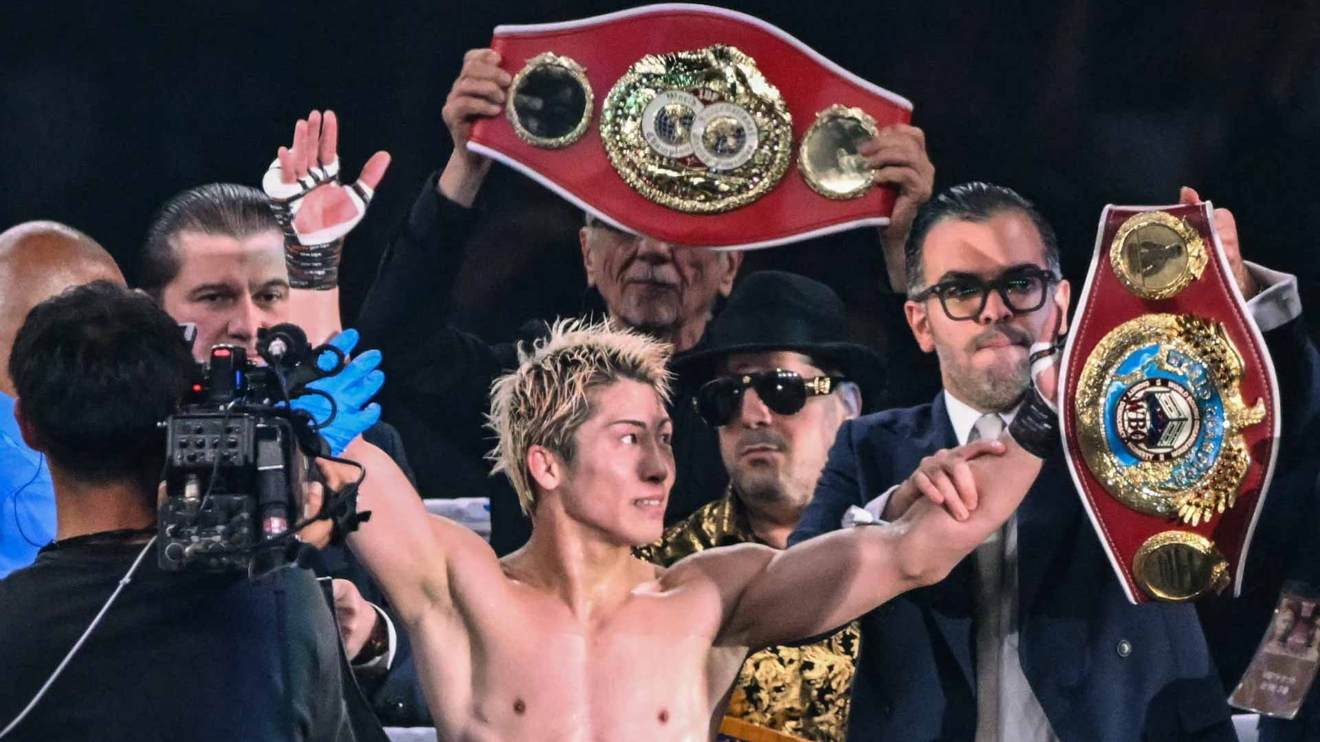 Image for the title: Inoue outlasts Nakatani in Tokyo Dome superfight 