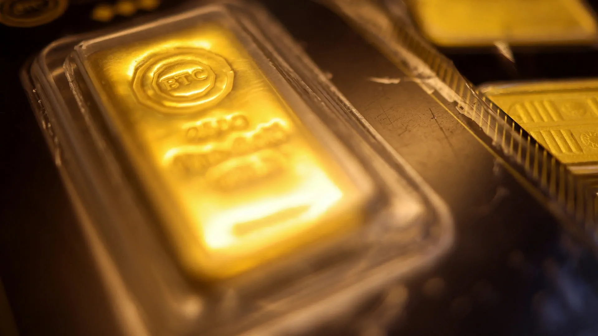 Gold edges lower on firmer dollar after strong US jobs data 