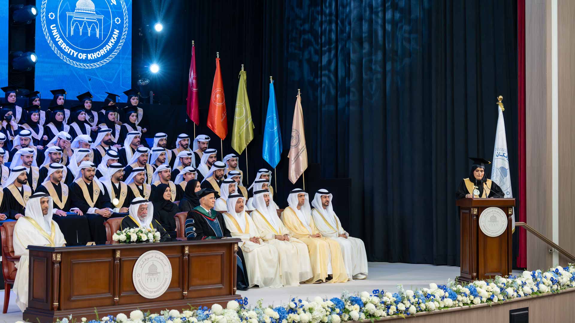 صورة بعنوان: <span class="scChromeData">{"commands":[{"click":"chrome:common:edititem({command:\"webedit:open\"})","header":"Edit the related item","icon":"/temp/iconcache/office/16x16/cubes.png","disabledIcon":"/temp/cubes_disabled16x16.png","isDivider":false,"tooltip":"Edit the related item in the Content Editor.","type":"common"},{"click":"chrome:rendering:personalize({command:\"webedit:personalize\"})","header":"Personalize","icon":"/temp/iconcache/office/16x16/users_family.png","disabledIcon":"/temp/users_family_disabled16x16.png","isDivider":false,"tooltip":"Create or edit personalization for this component.","type":"sticky"},{"click":"chrome:rendering:editvariations({command:\"webedit:editvariations\"})","header":"Edit variations","icon":"/temp/iconcache/office/16x16/windows.png","disabledIcon":"/temp/windows_disabled16x16.png","isDivider":false,"tooltip":"Edit the variations.","type":"sticky"}],"contextItemUri":"sitecore://master/{2CE2FCAD-3282-4EE6-94C9-8A42F7F51296}?lang=ar&ver=1","custom":{},"displayName":"Title","expandedDisplayName":"This is require field and Maximum 90 character is allow"}</span><span sc_parameters="prevent-line-break=true" class="scWebEditInput scEnabledChrome" id="fld_2CE2FCAD32824EE694C98A42F7F51296_E873DAB3C3324E8EB106973D9F53F5B7_ar_1_4d02f8fcde3849199bb5bc7346e8462a_1729_edit" contenteditable="true" scdefaulttext="[No text in field]" scfieldtype="single-line text" sc-part-of="field">حاكم الشارقة يشهد حفل تخريج الدفعة الأولى من طلبة جامعة خورفكان</span>_A9B70CC0F7CF4EC0800B06DE34770281