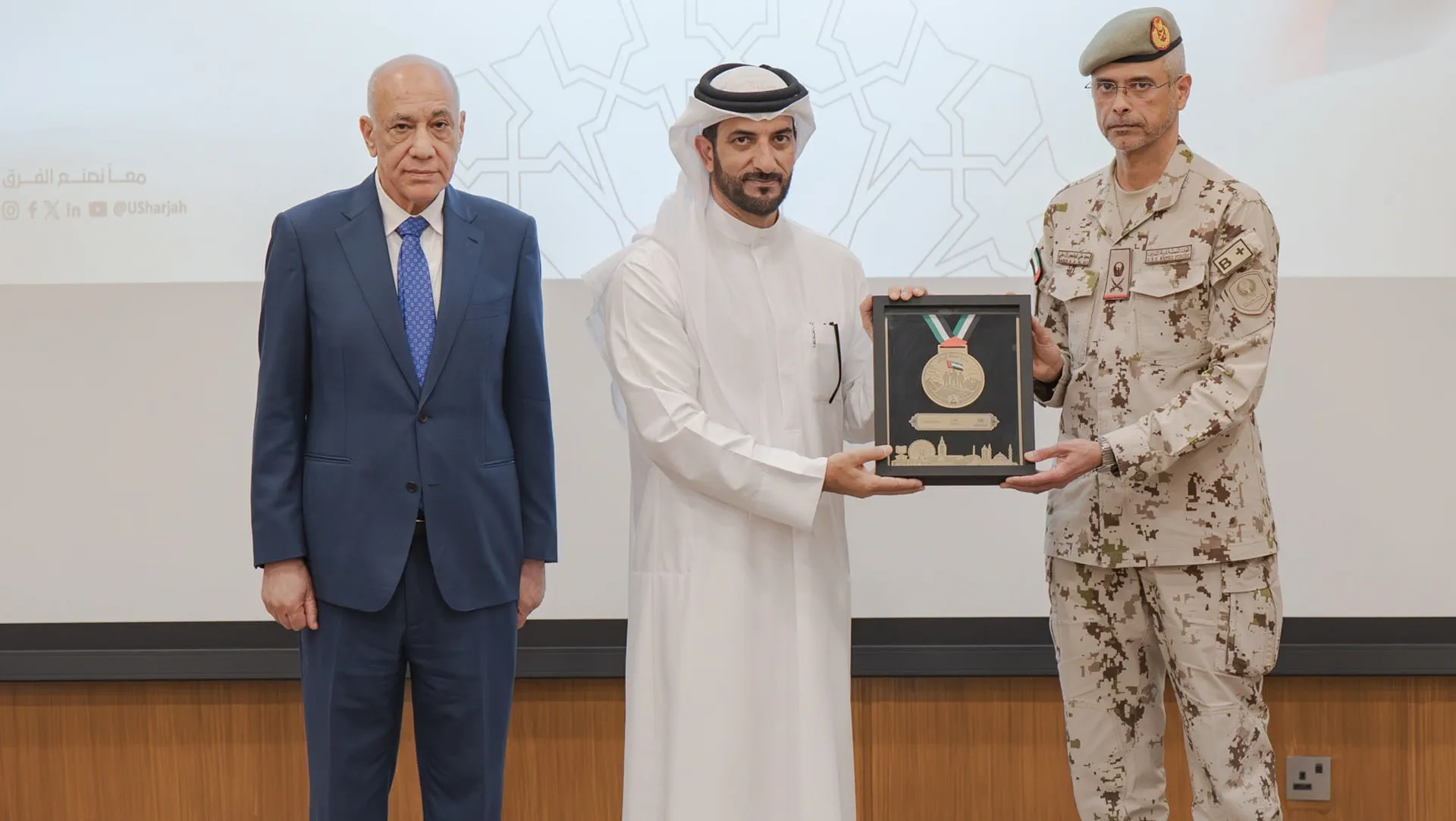 Sultan bin Ahmed honouring members at the event