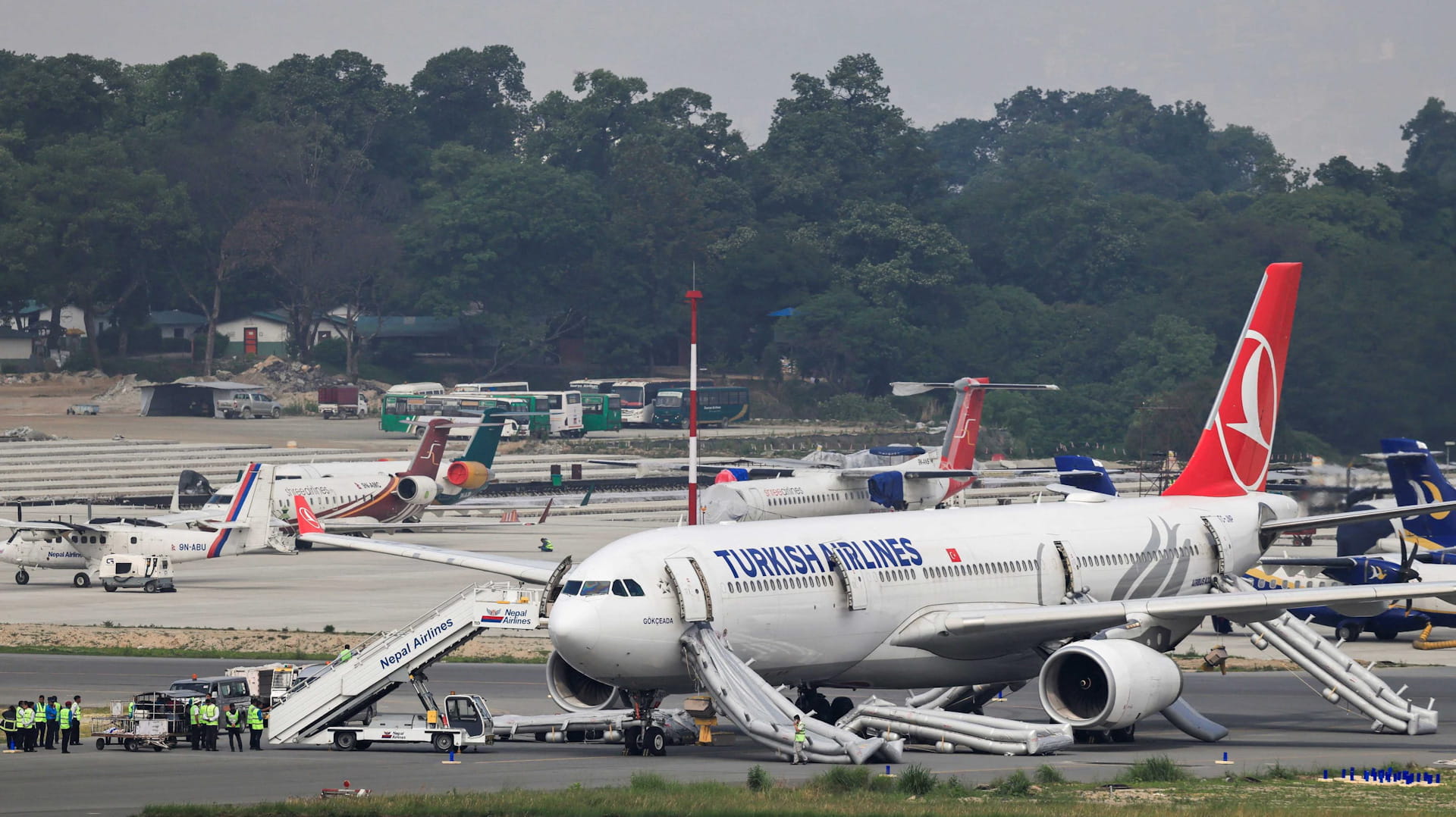 Image for the title: Turkish Airlines plane catches fire at Nepal airport 