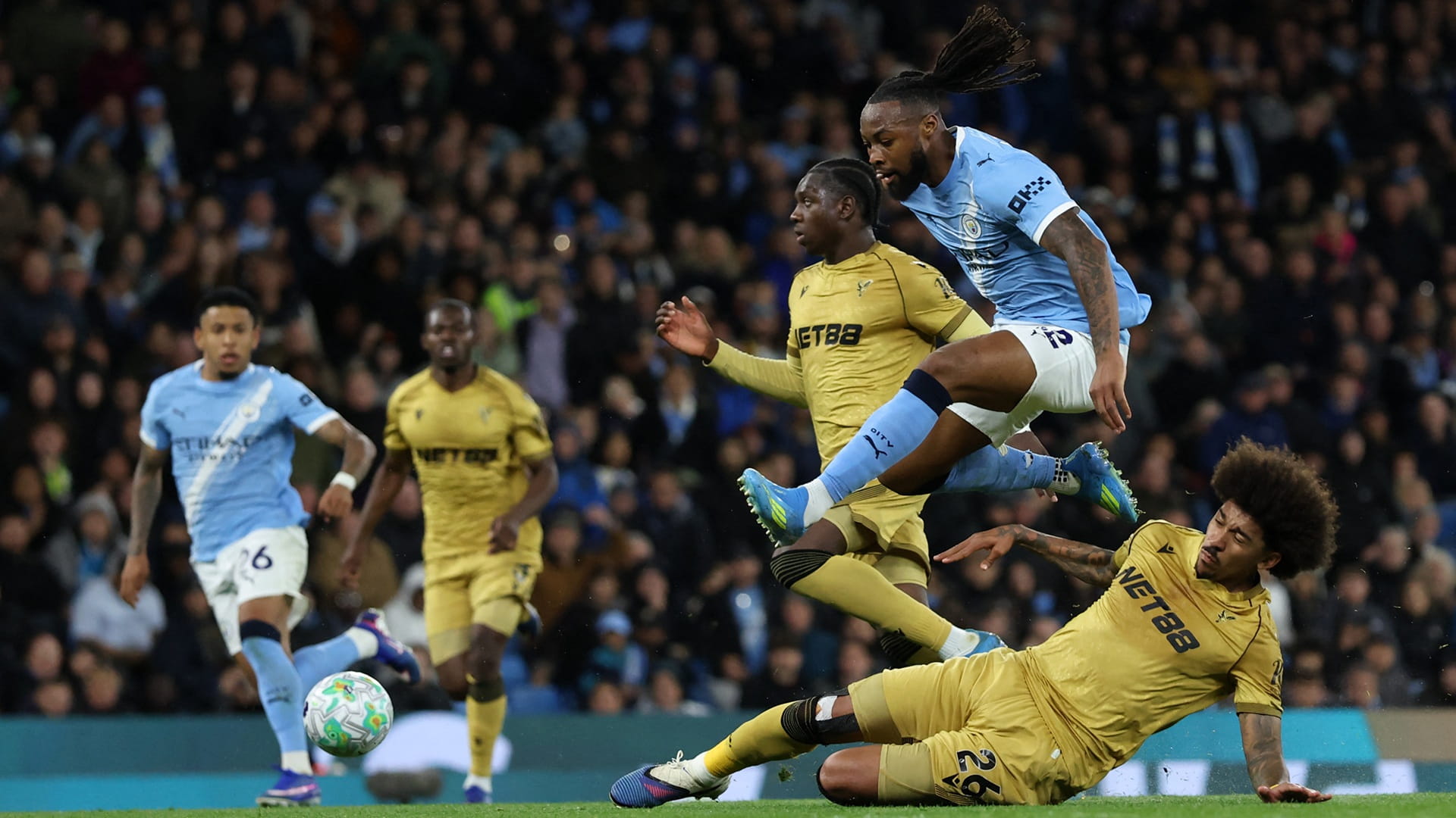 Image for the title: Man City ease past Palace to keep pressure on Arsenal 