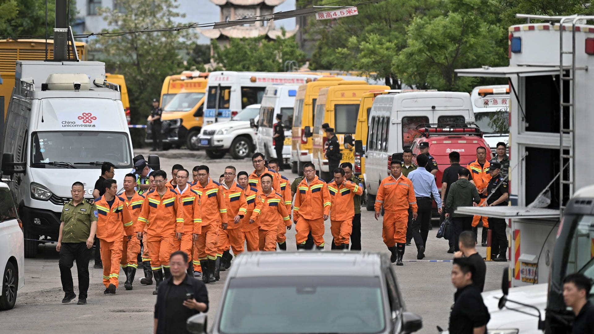 Image for the title: China rescuers search for missing after mine blast kills 82 